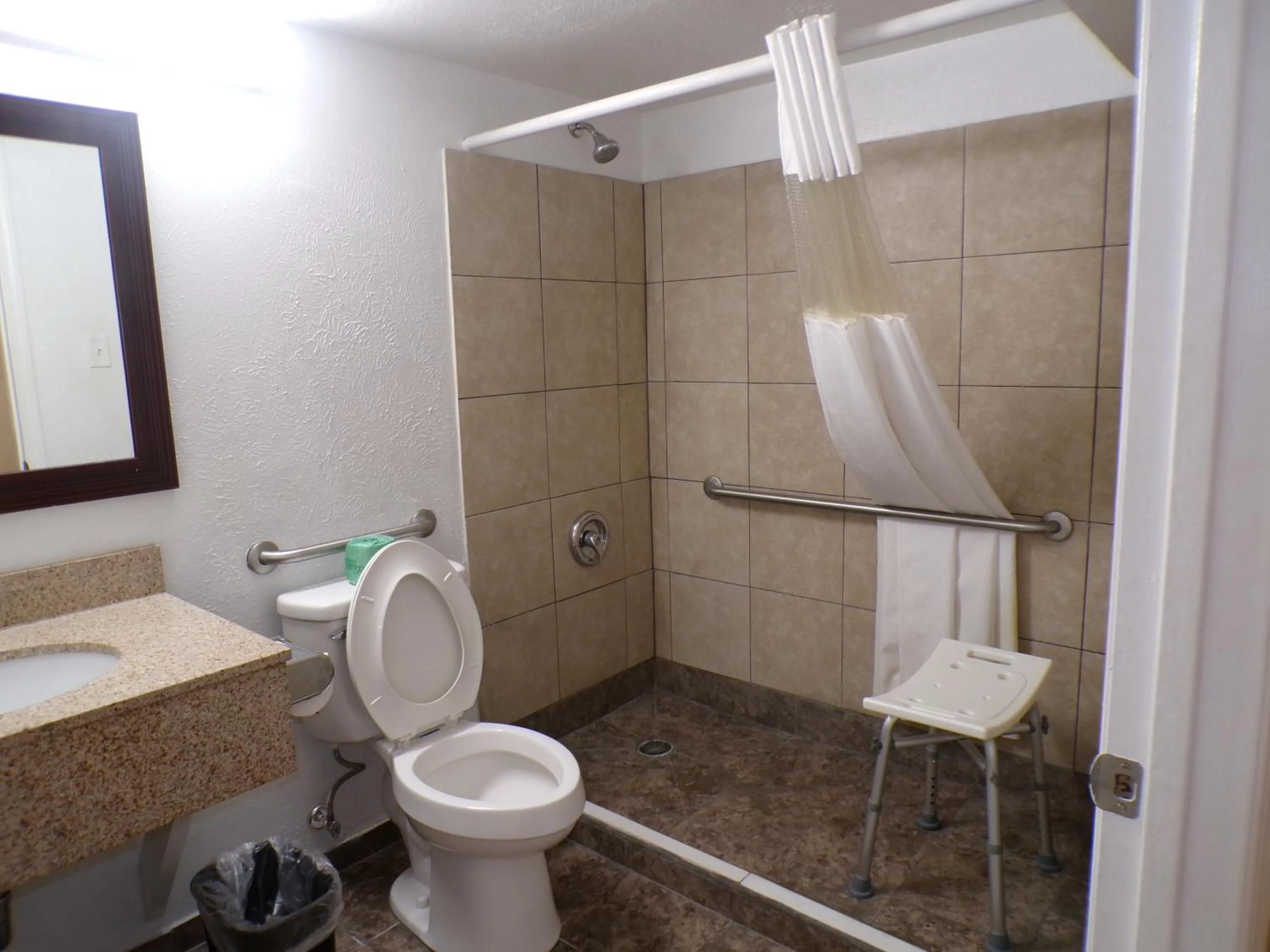 Shower in Regal 8 Inn & Suites