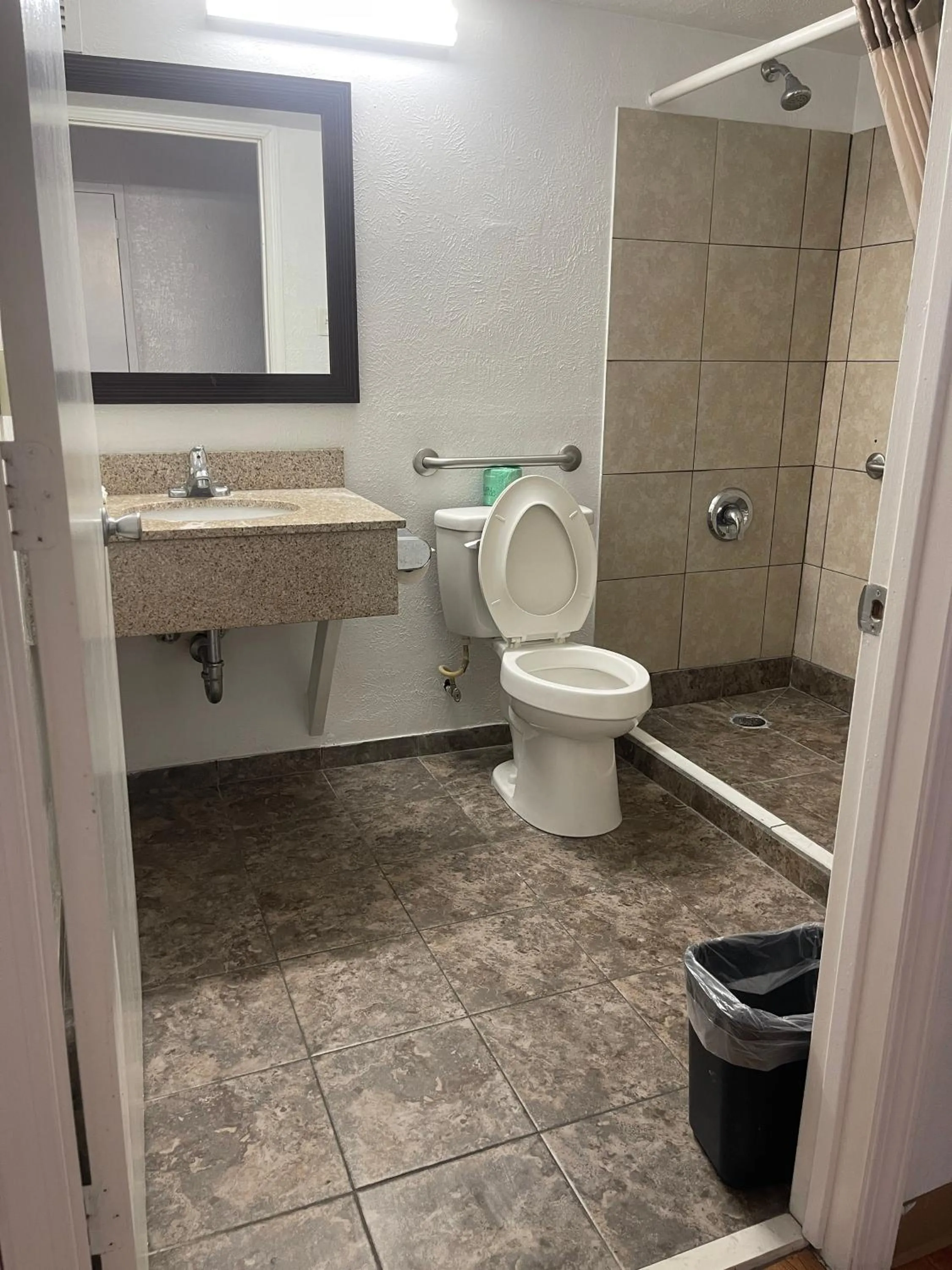 Shower in Regal 8 Inn & Suites