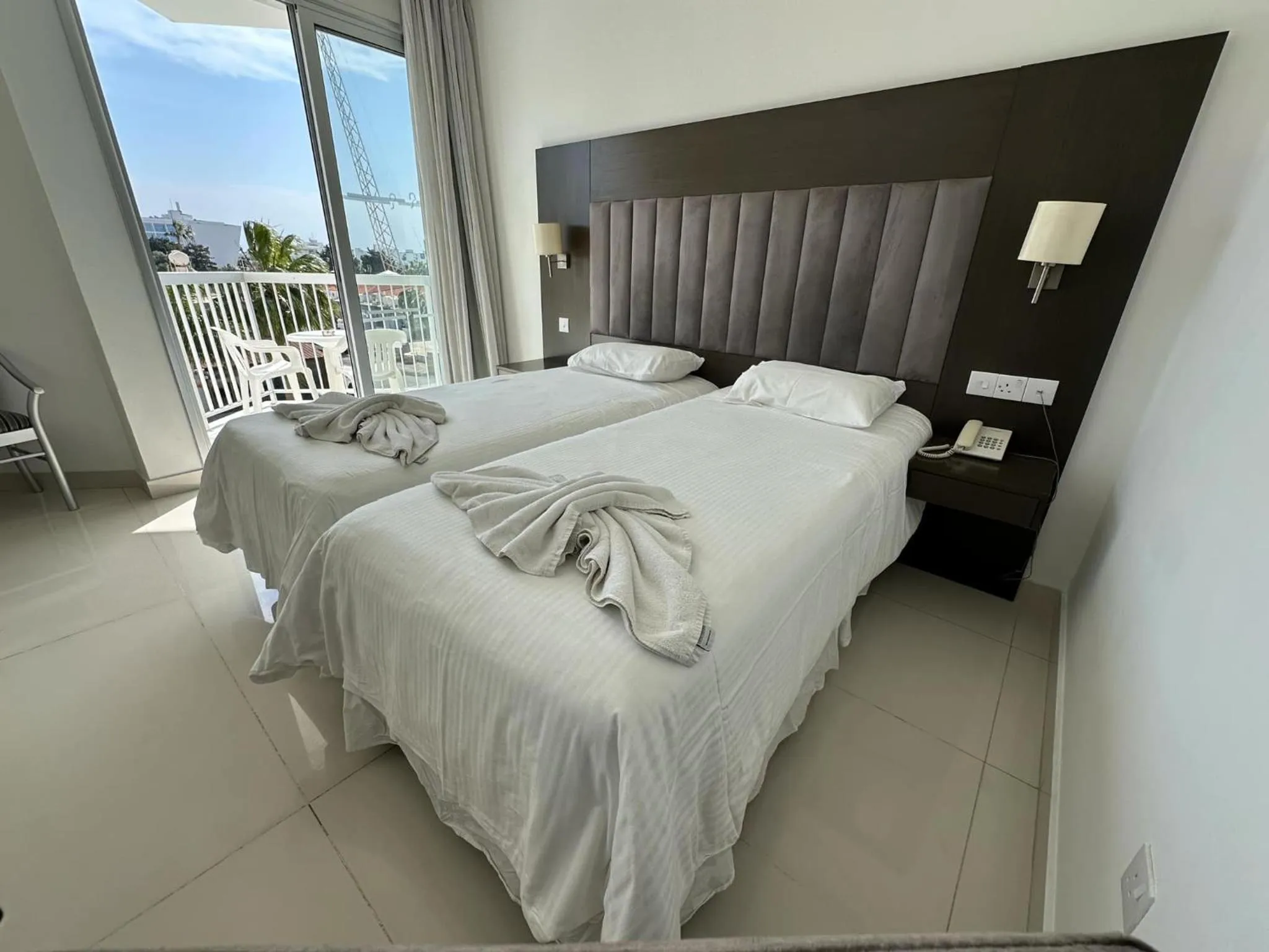 Seating area, Bed in Napa Jay Hotel