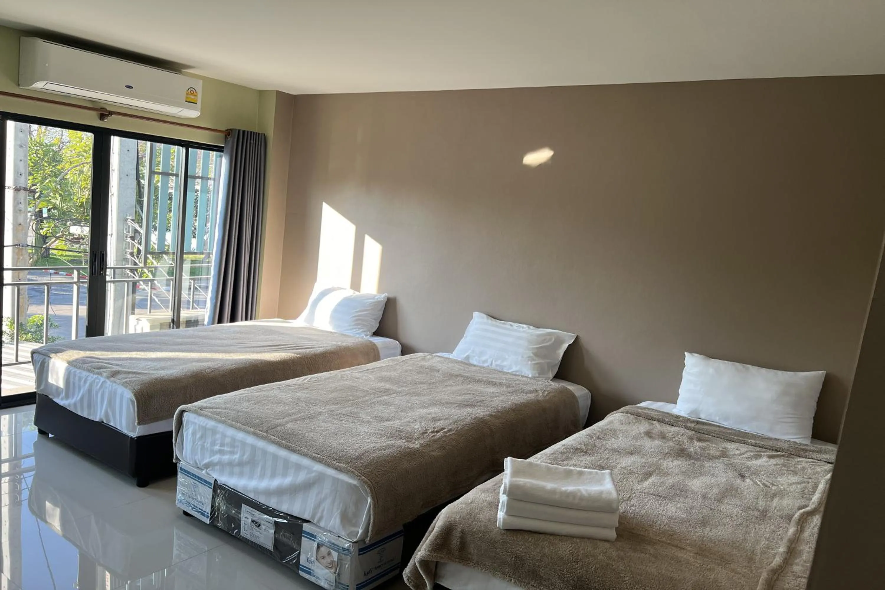 Bed in V Tharm Hotel