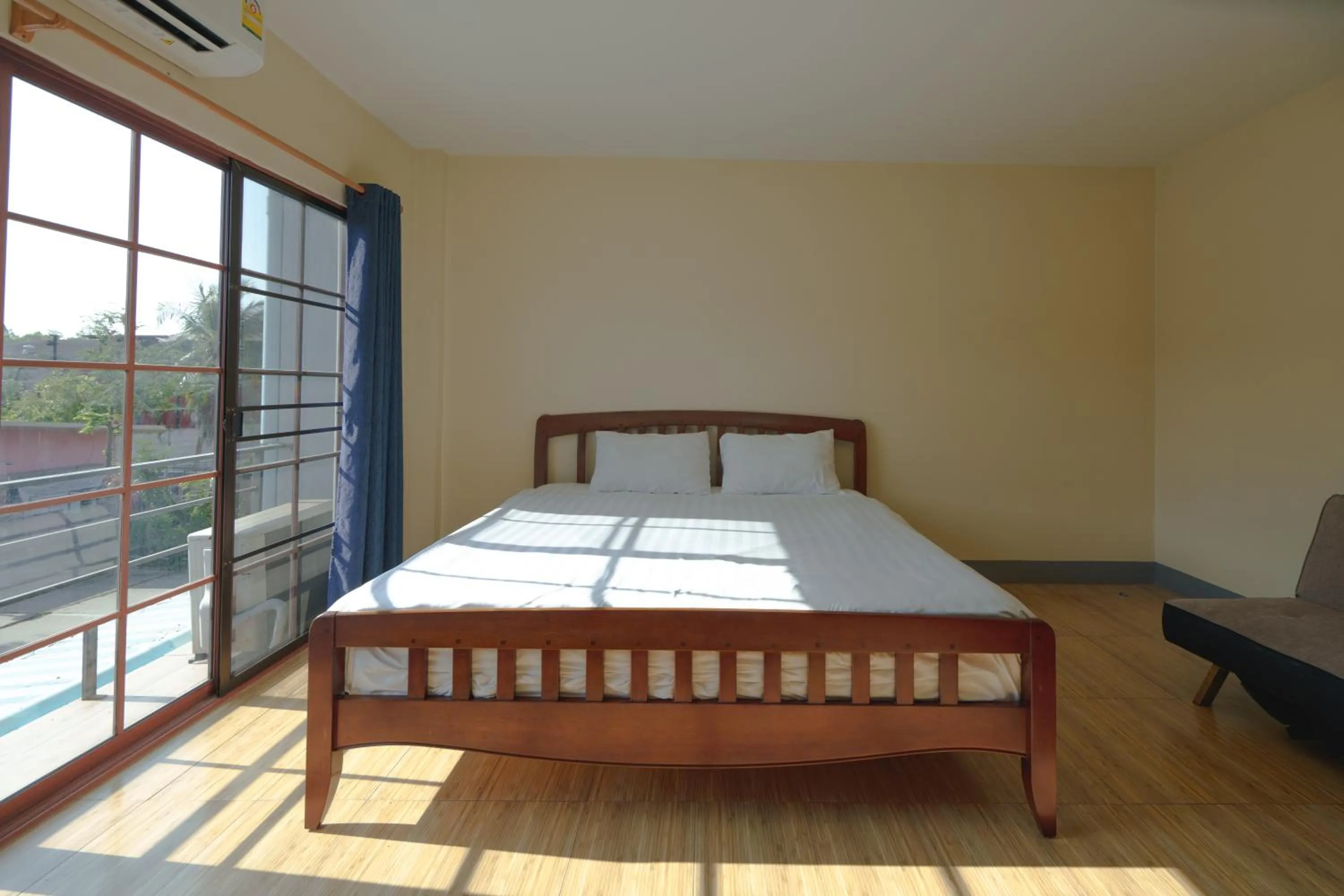 Bed in V Tharm Hotel