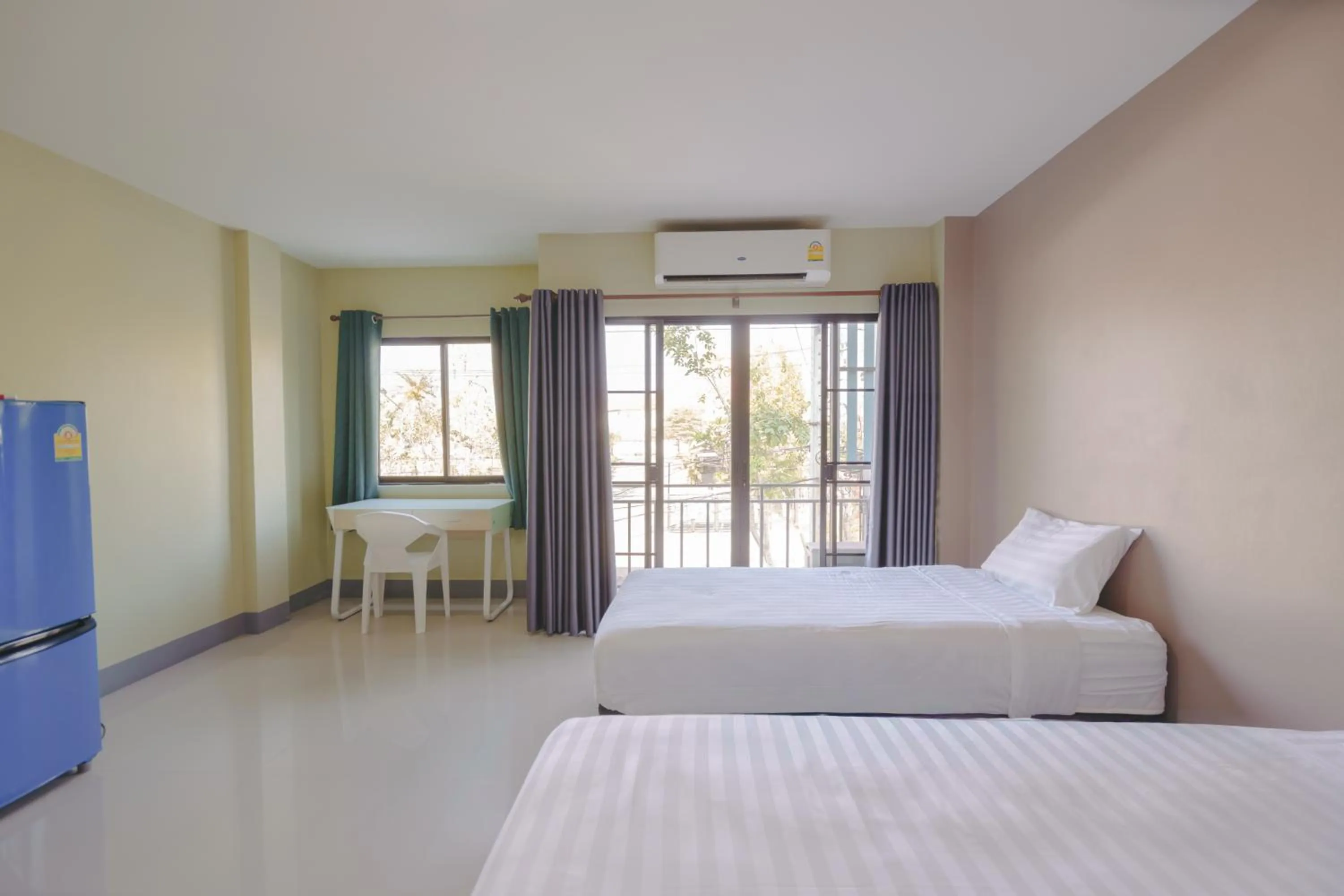 Bed in V Tharm Hotel