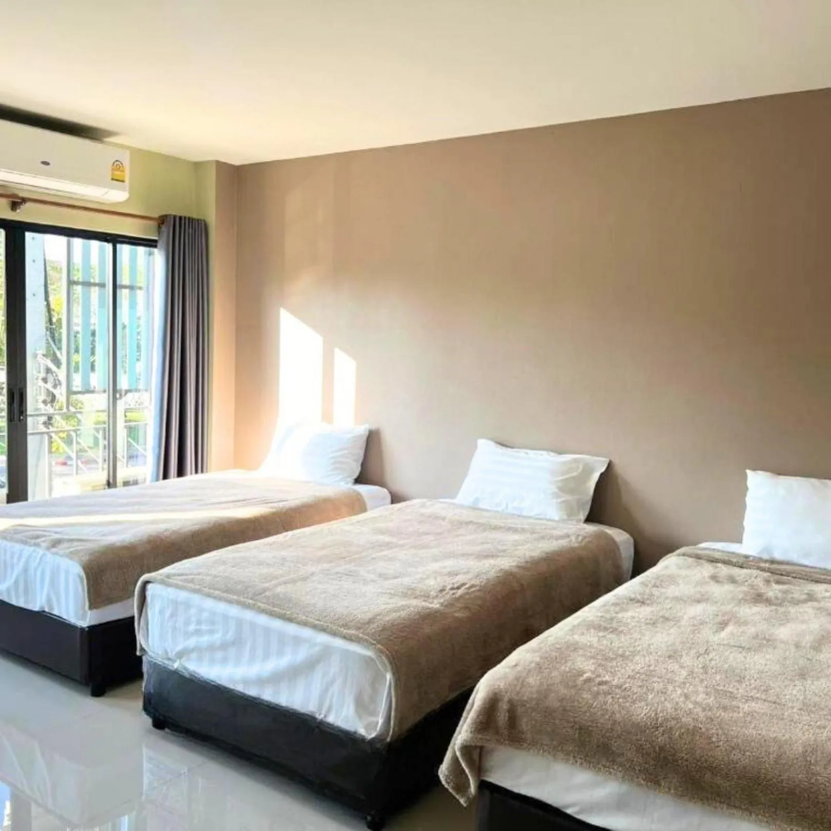 Bed in V Tharm Hotel