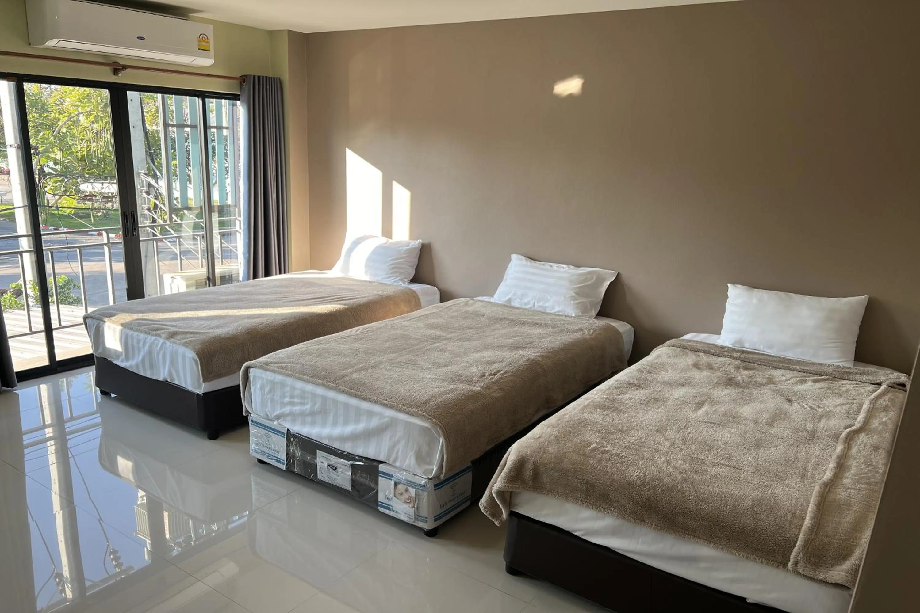 Bed in V Tharm Hotel