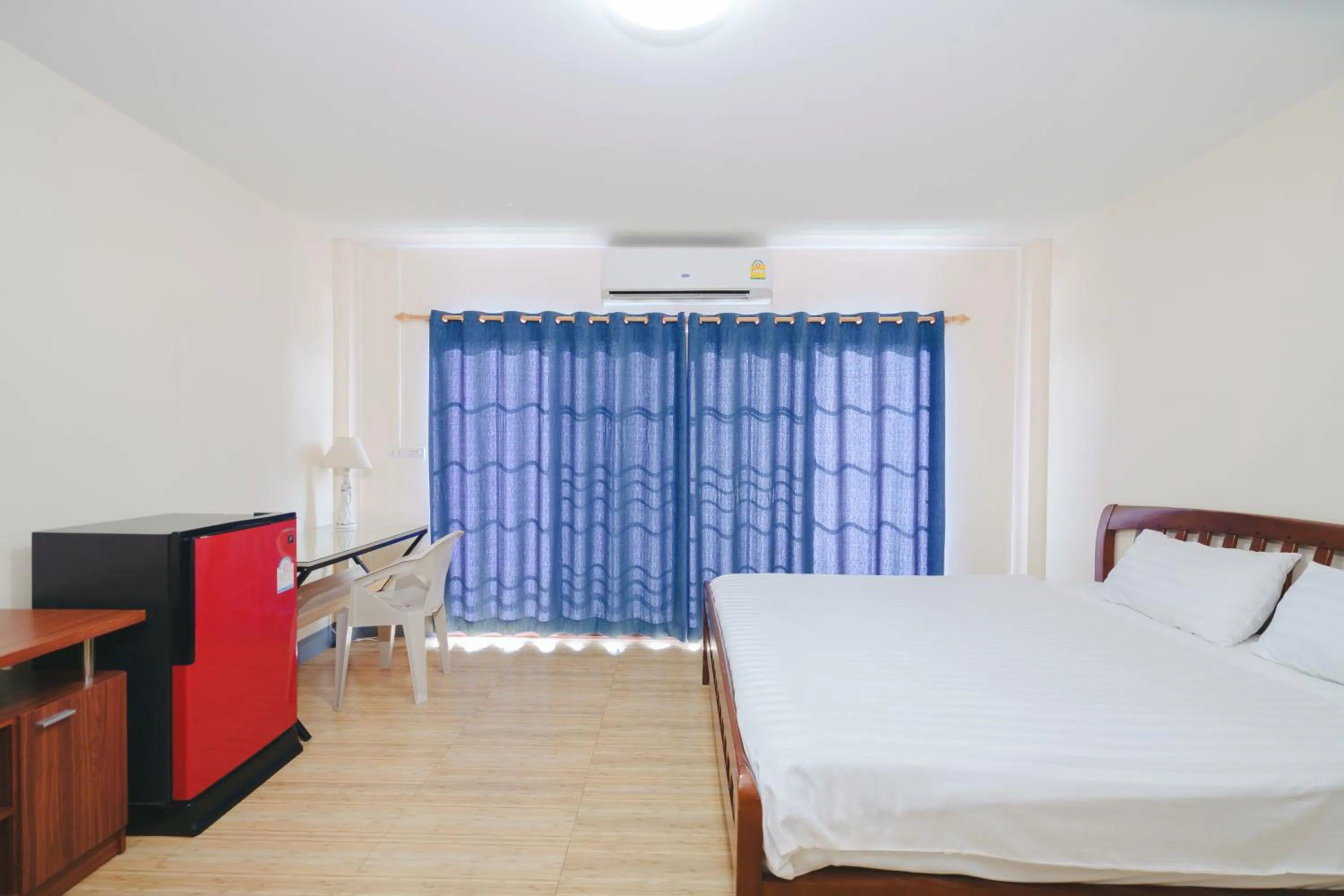 Bed in V Tharm Hotel