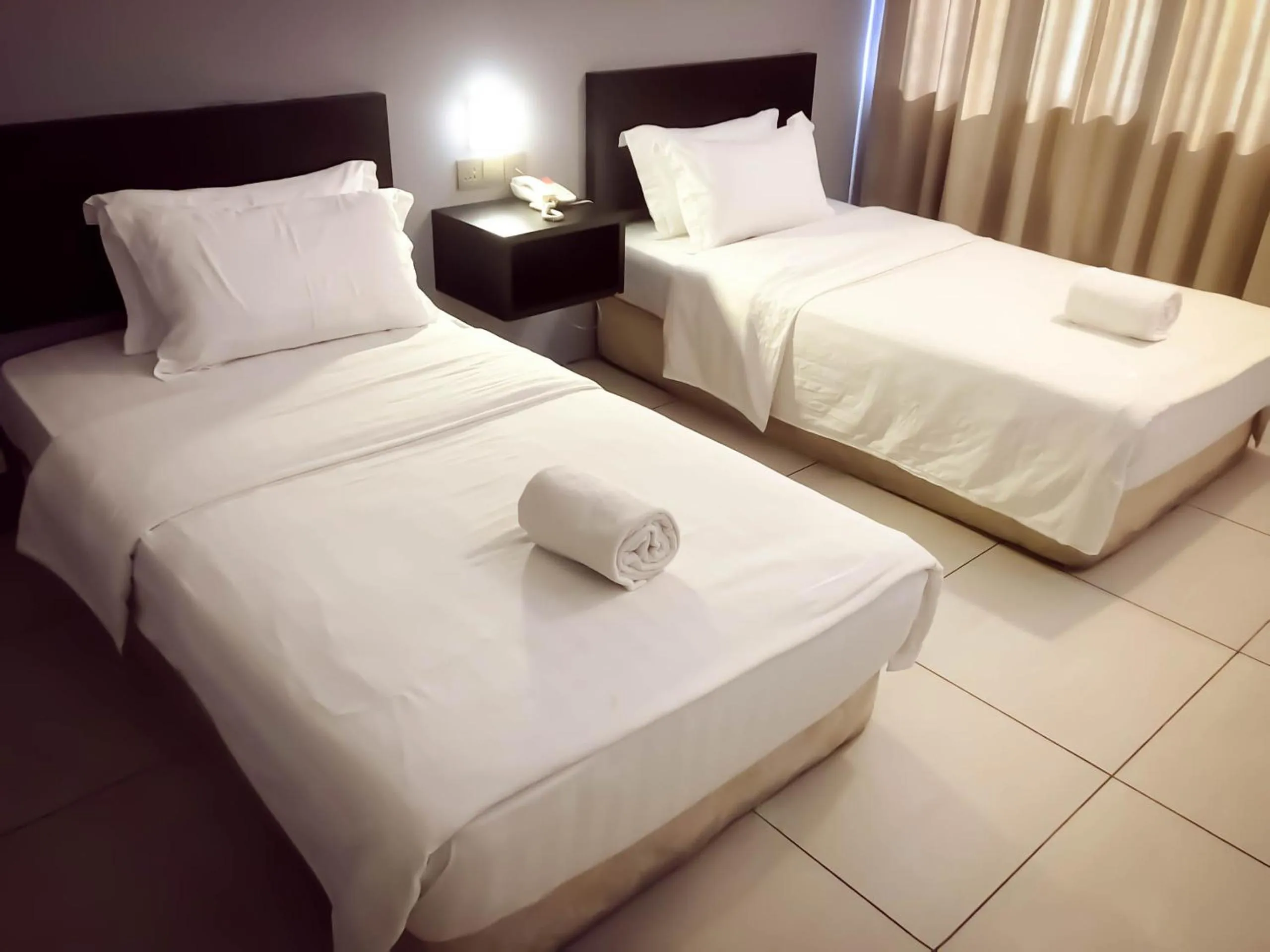 Bed in De Choice Hotel Tawau