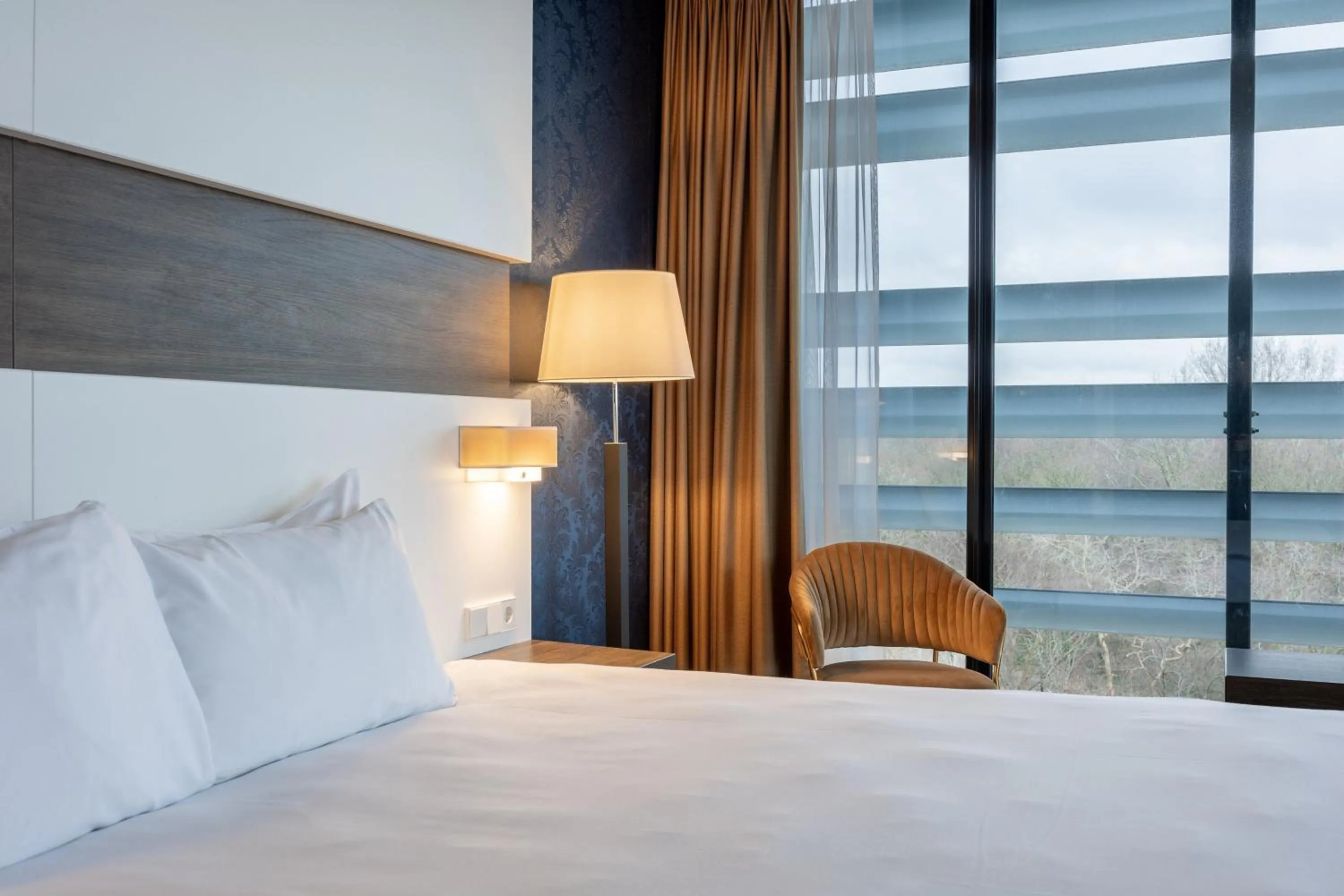 Bedroom, Bed in Leonardo Royal Hotel Den Haag Promenade