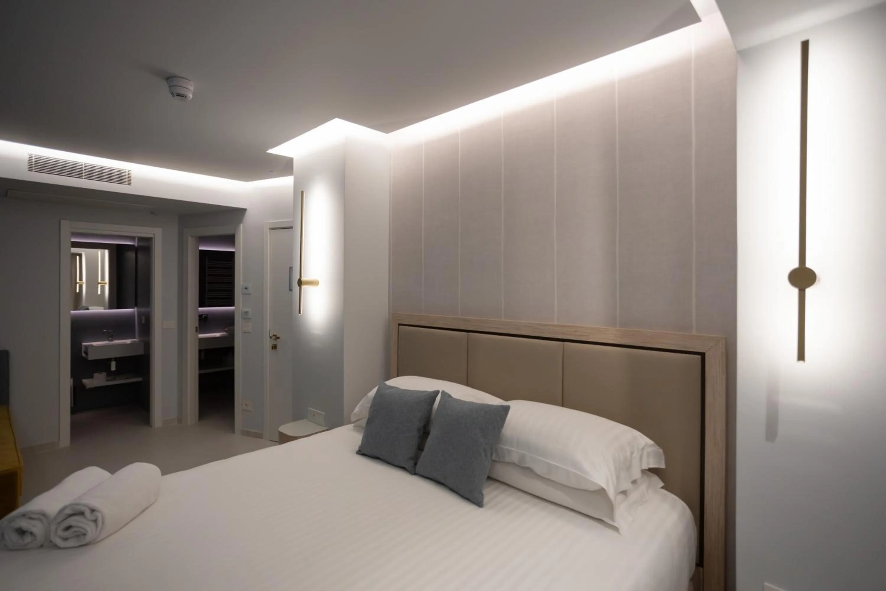 Bed in Ambasciatori Suite Hotel