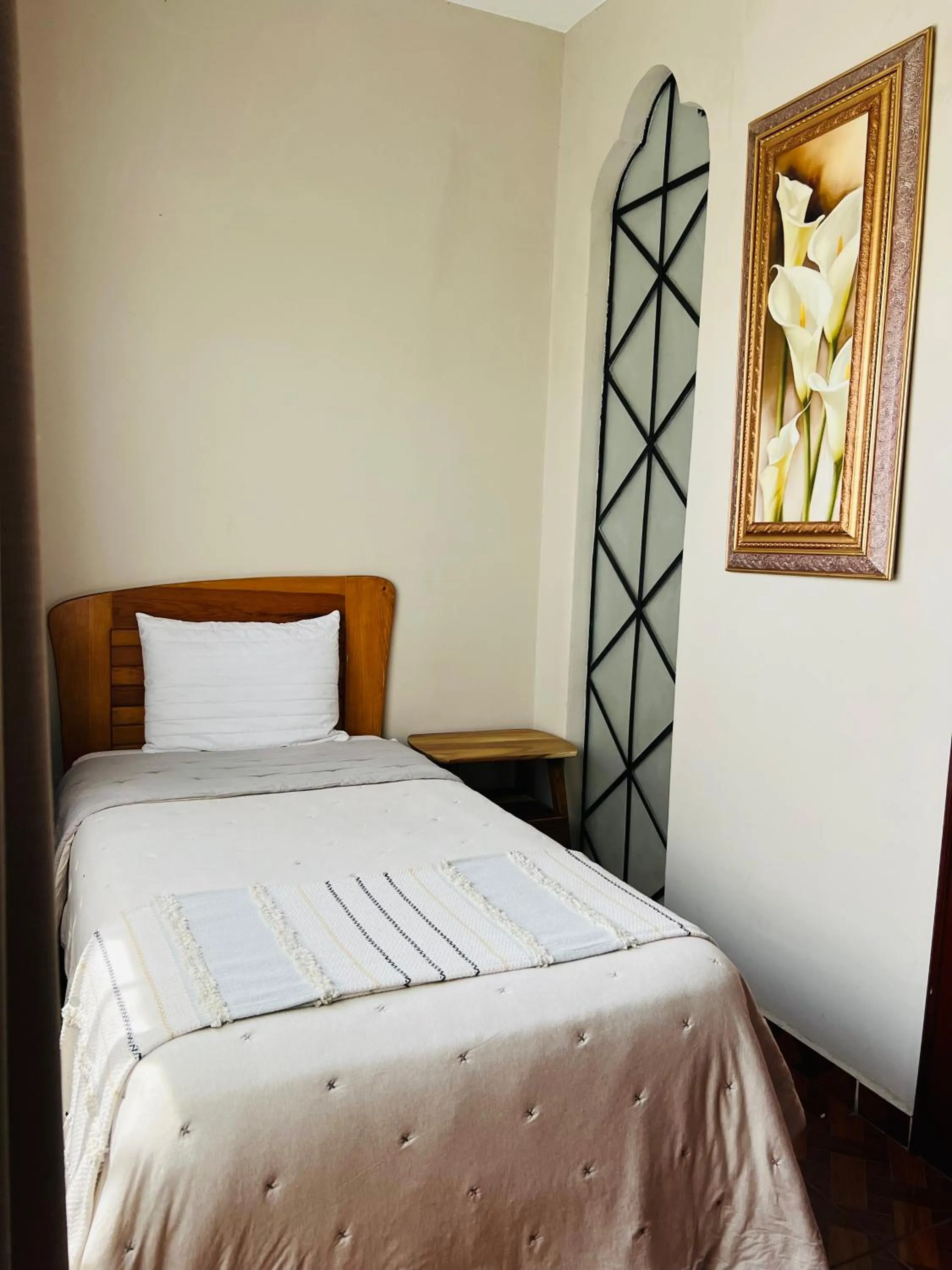 Bed in Hostería Casa Marquez