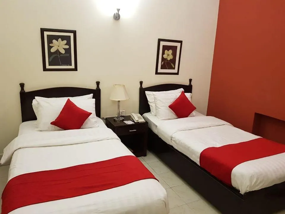 Bed in Herfa INN Hotel Lahore