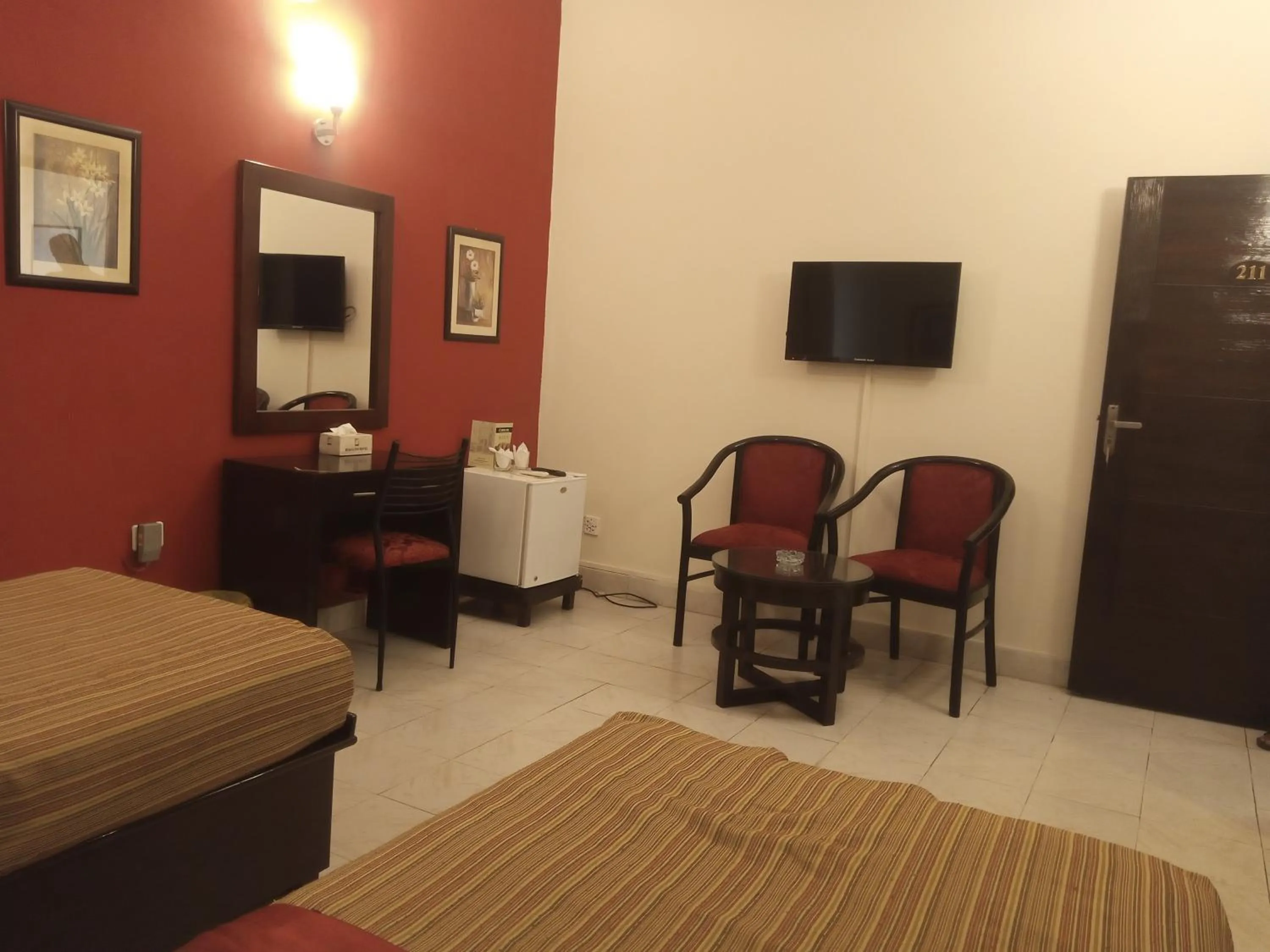 Seating area, Bed in Herfa INN Hotel Lahore