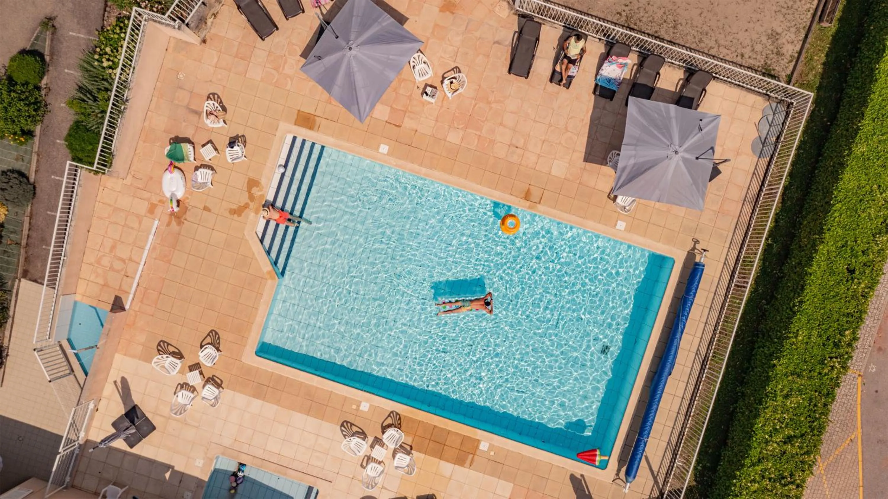 Swimming pool in LOGIS HOTEL L'HÔTEL DES BAINS - Salles-la-Source