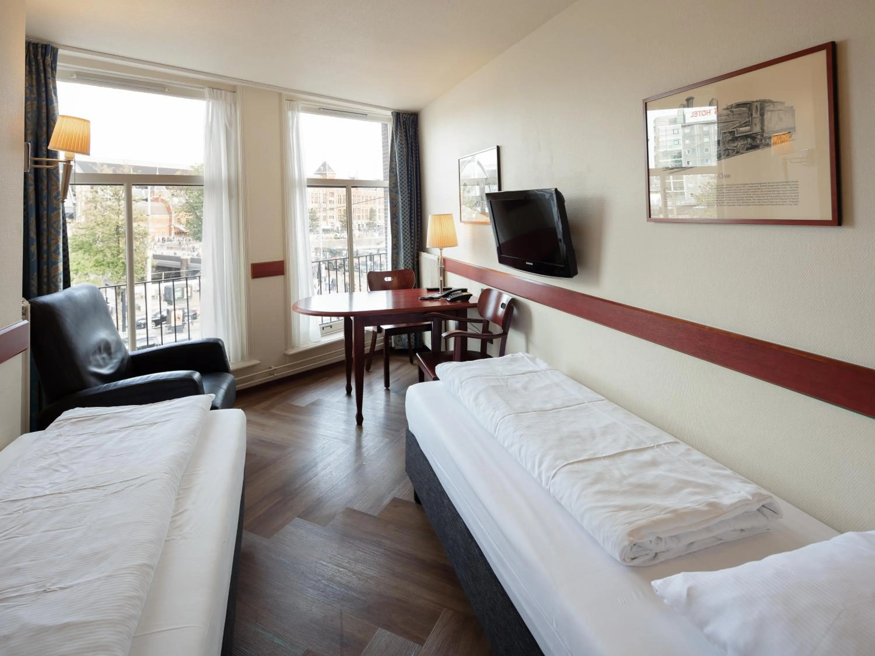 Bed in A-Train Hotel