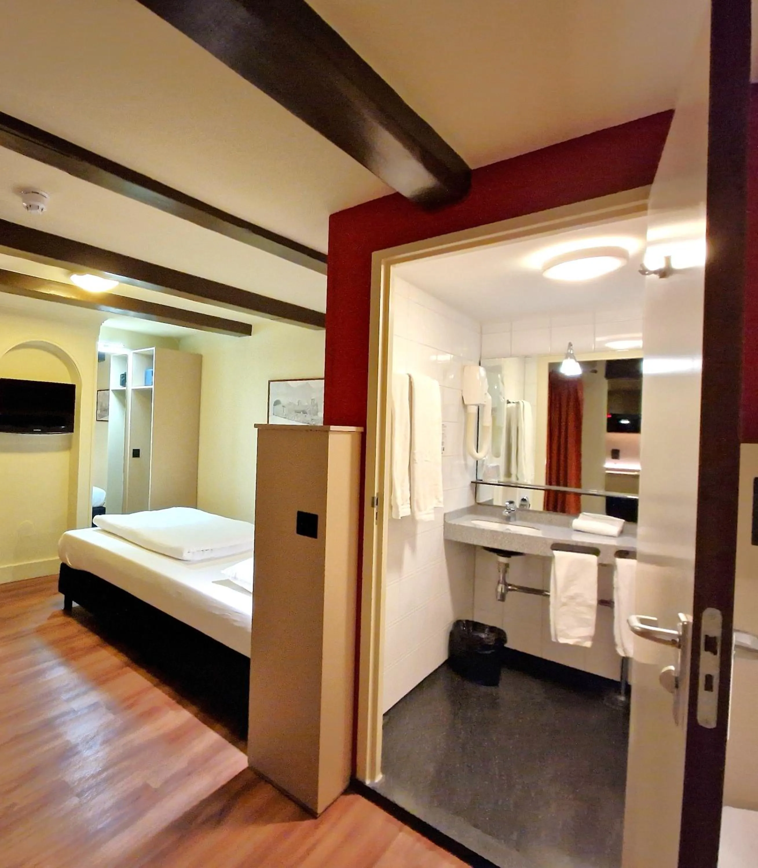 Bed in A-Train Hotel