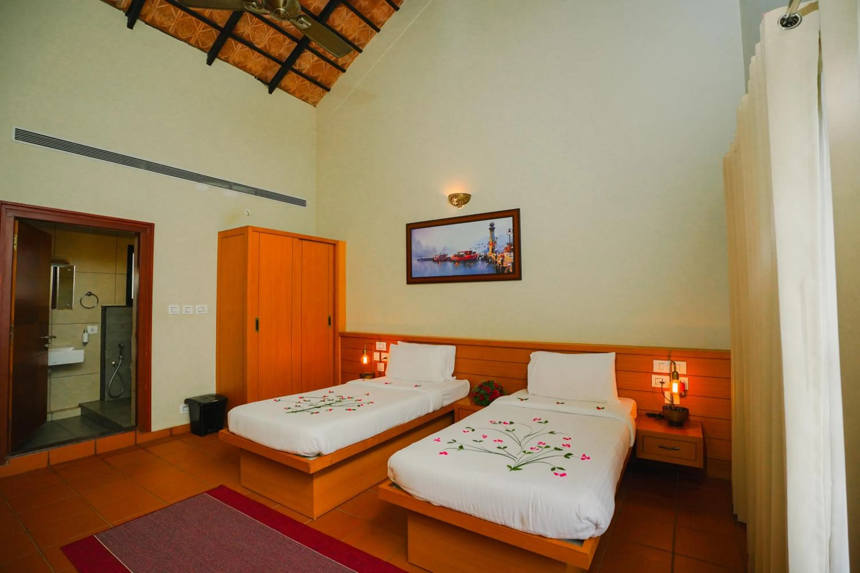 Bed in Vaidekam Resorts & Wellness, Kannur