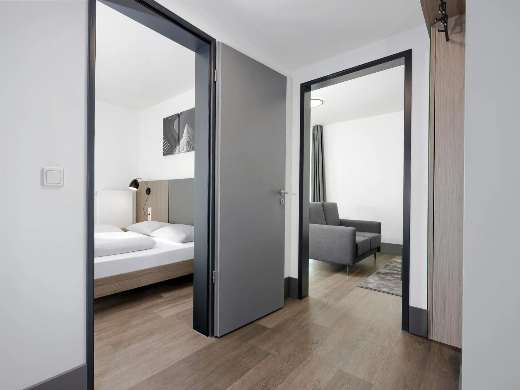 Living room, Bed in smartments Frankfurt City-Ost