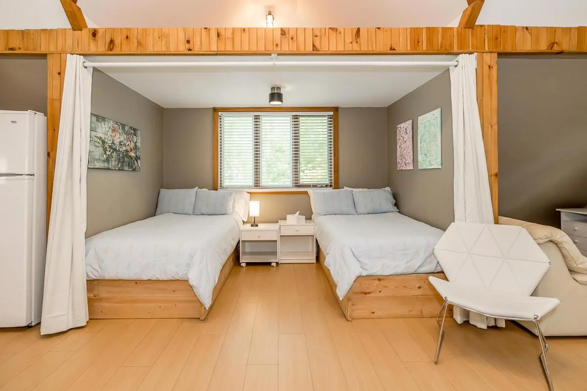 Bed in Muskoka Lakeshore Cottage Bliss