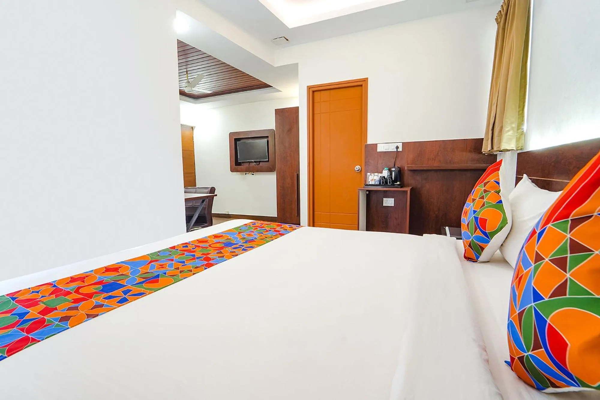 Bed in FabHotel Ellegant Inn