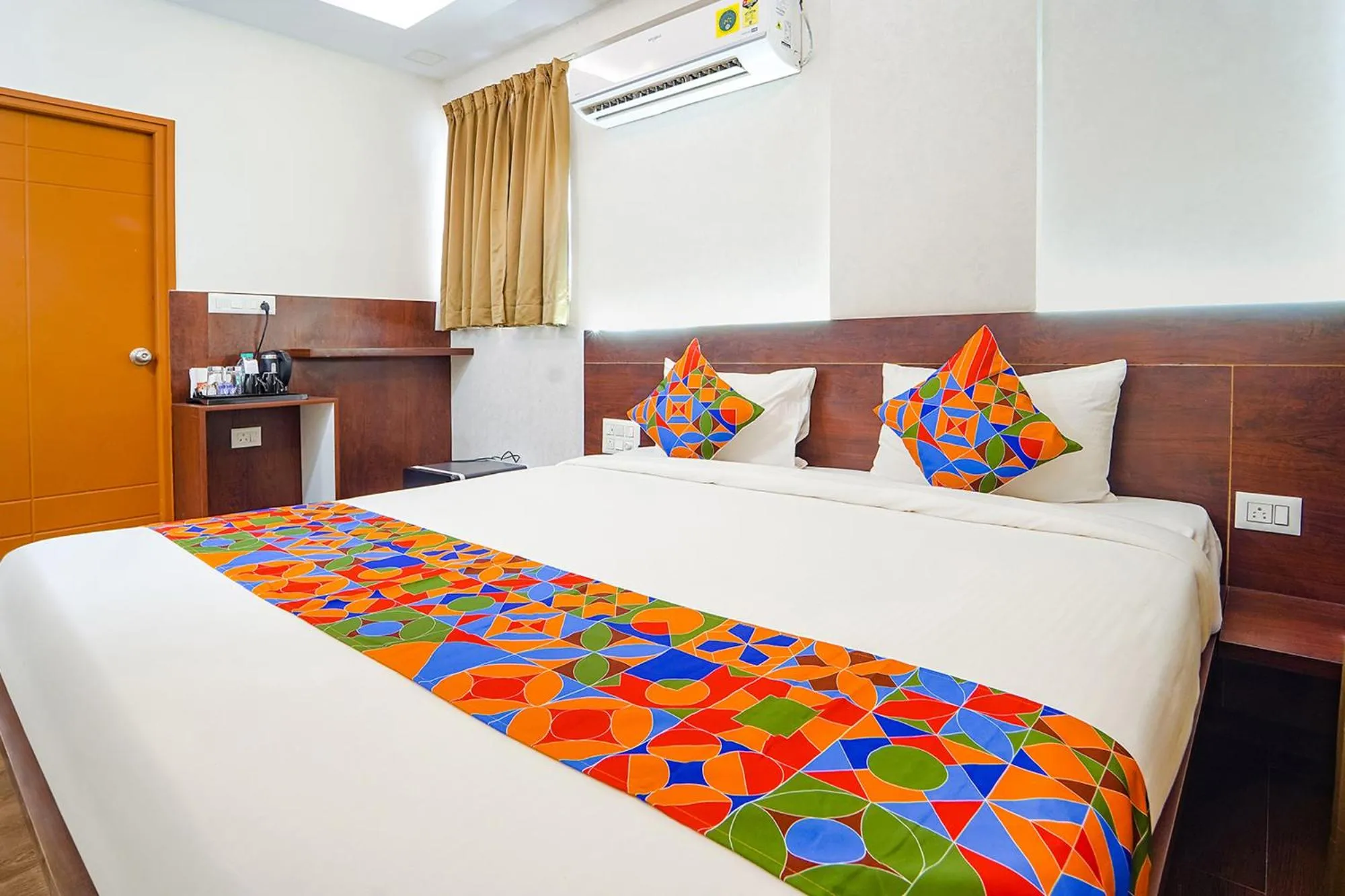 Bed in FabHotel Ellegant Inn