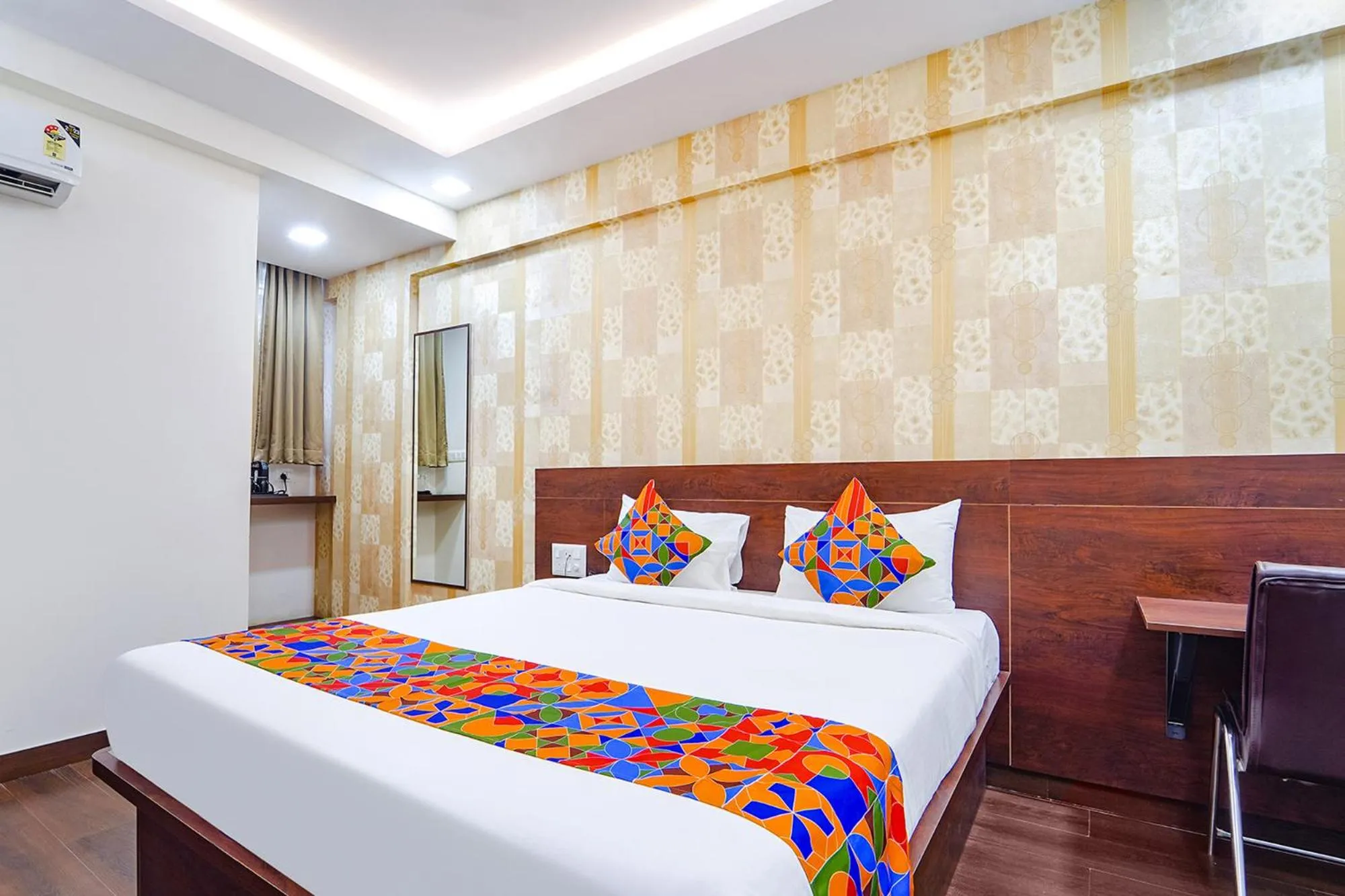 Bed in FabHotel Ellegant Inn