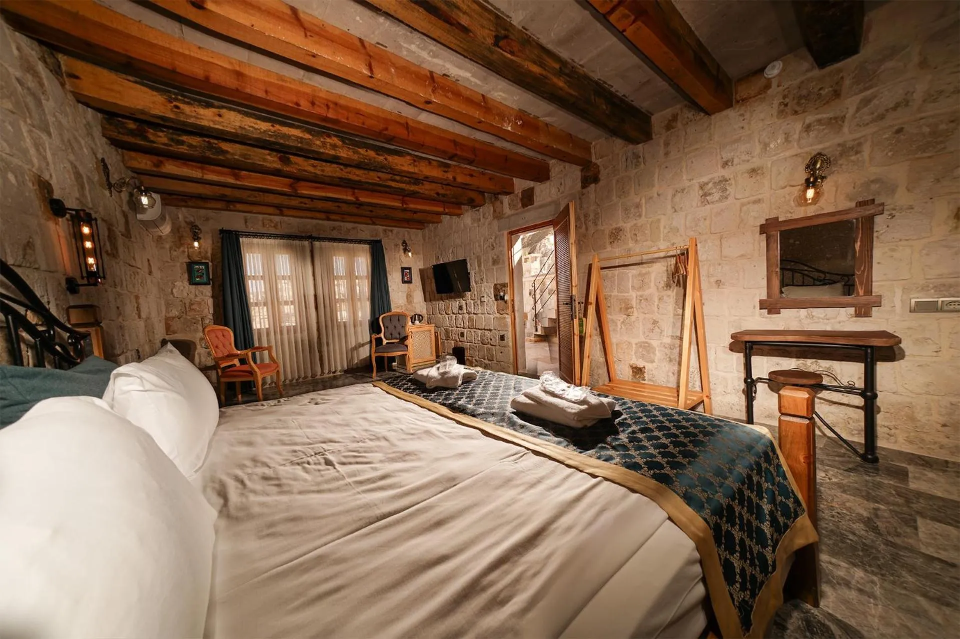 Bed in Caverna Hotel Premium Caves