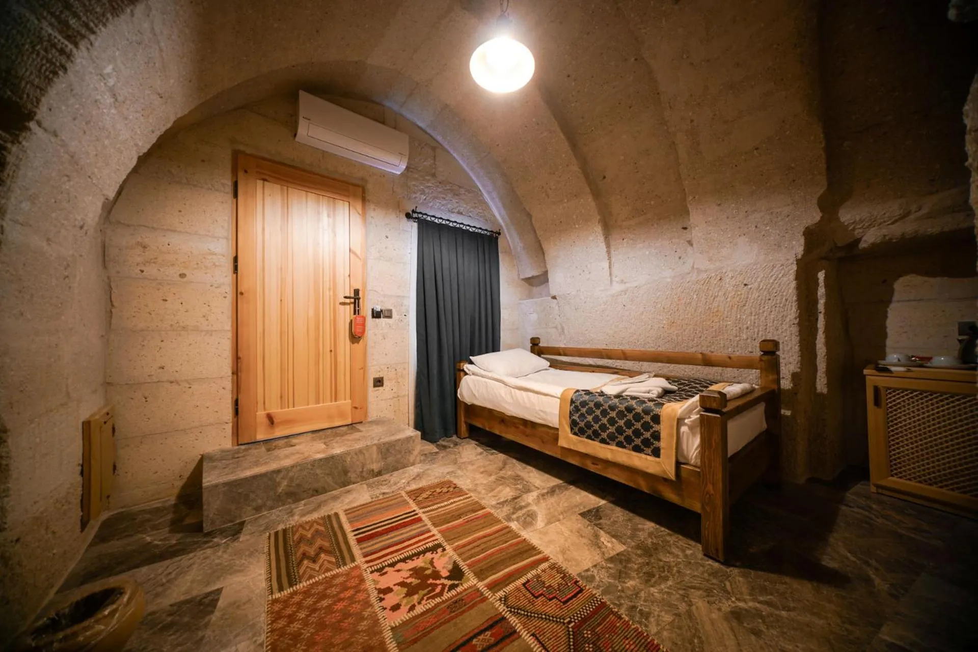 Bed in Caverna Hotel Premium Caves