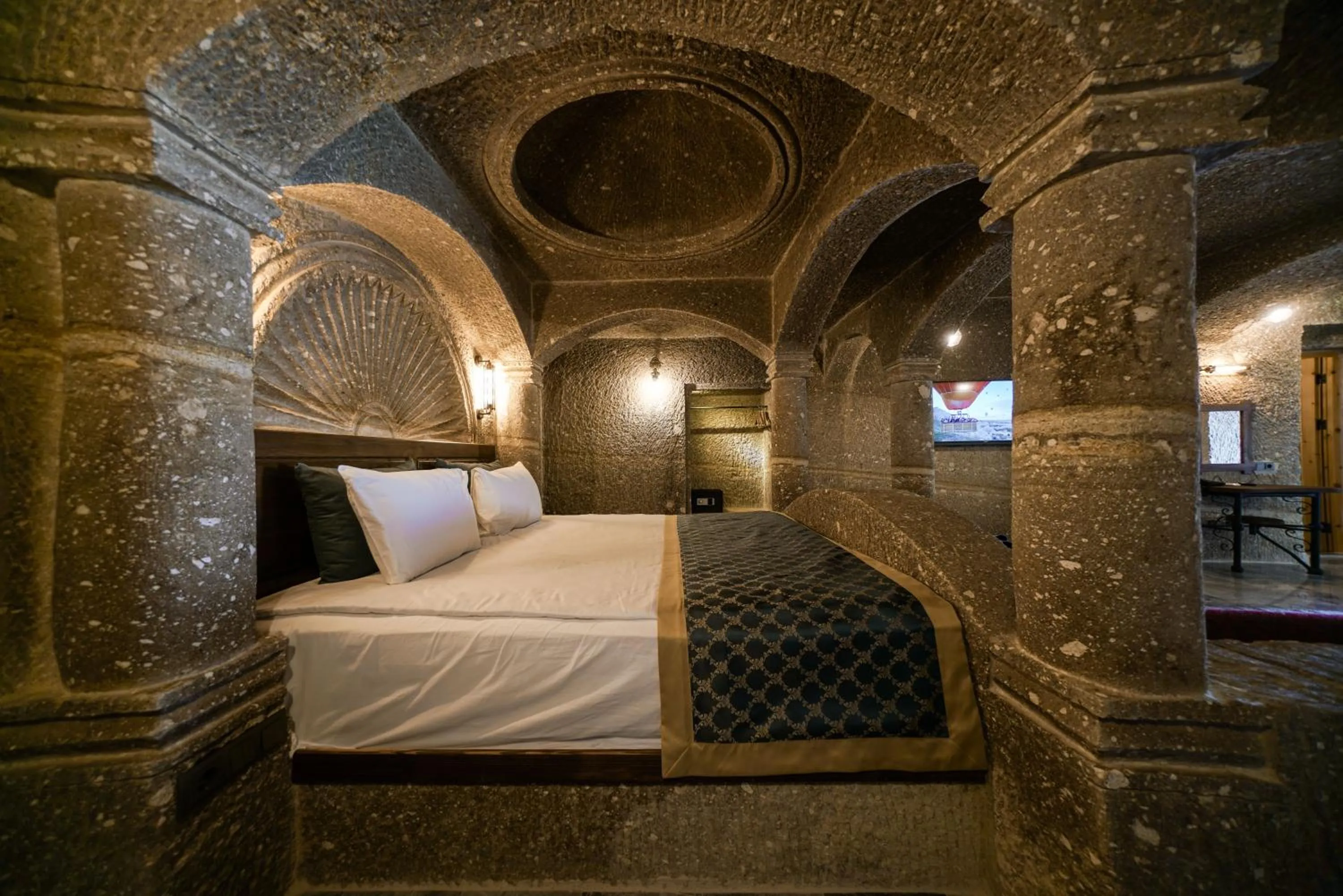 Bed in Caverna Hotel Premium Caves