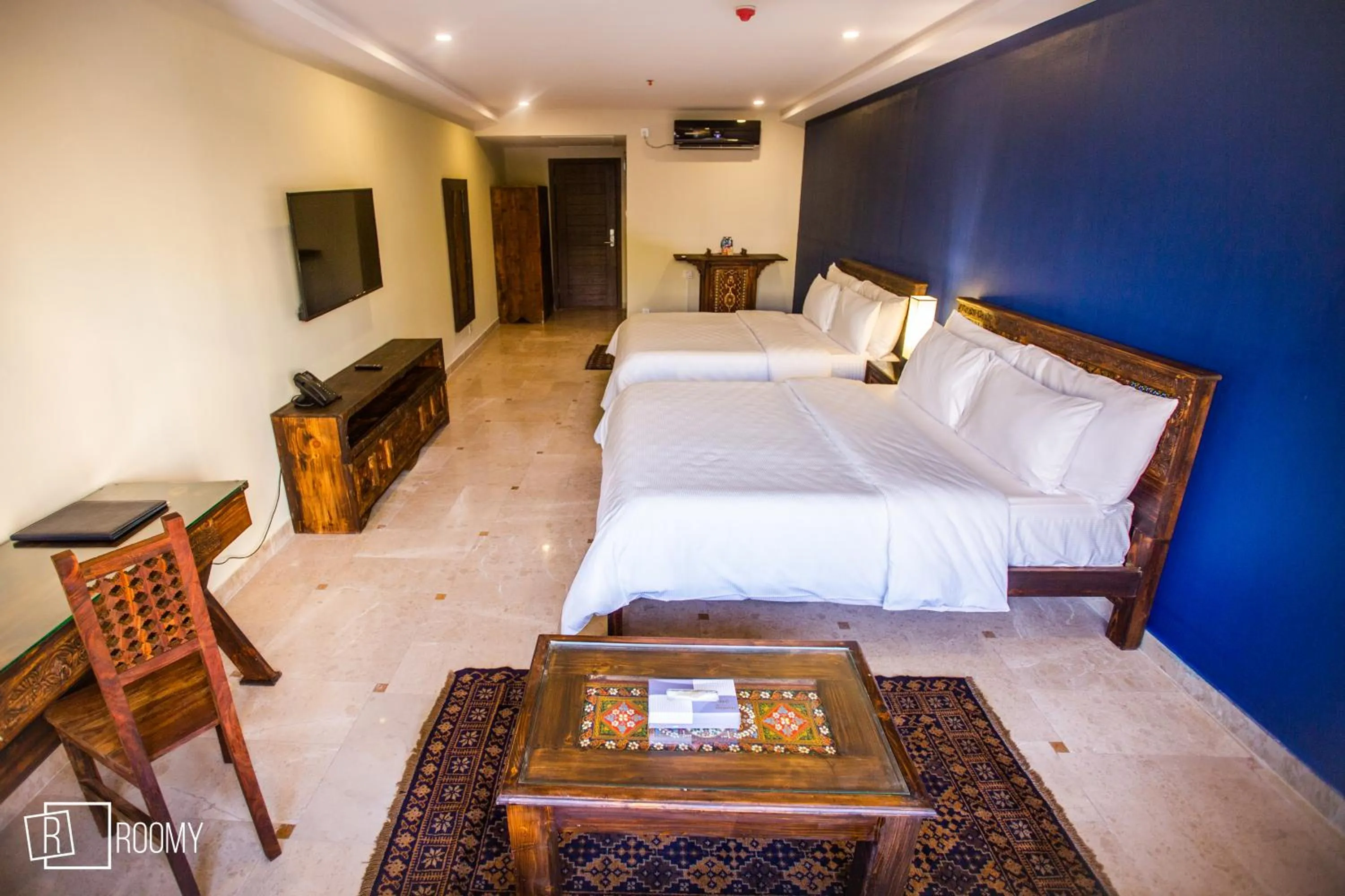 Bed in Roomy Signature Hotel, Islamabad