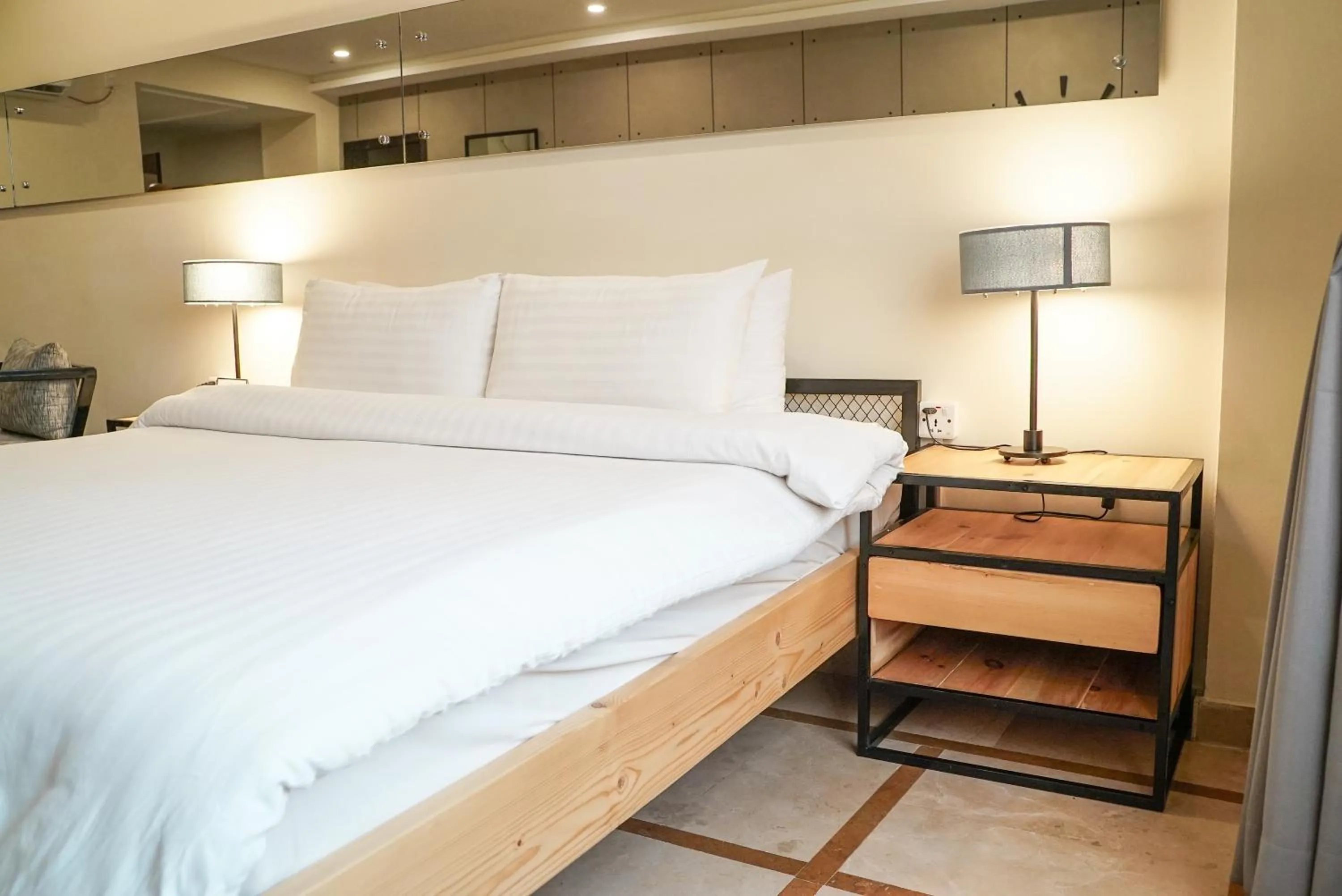 Bed in Roomy Signature Hotel, Islamabad