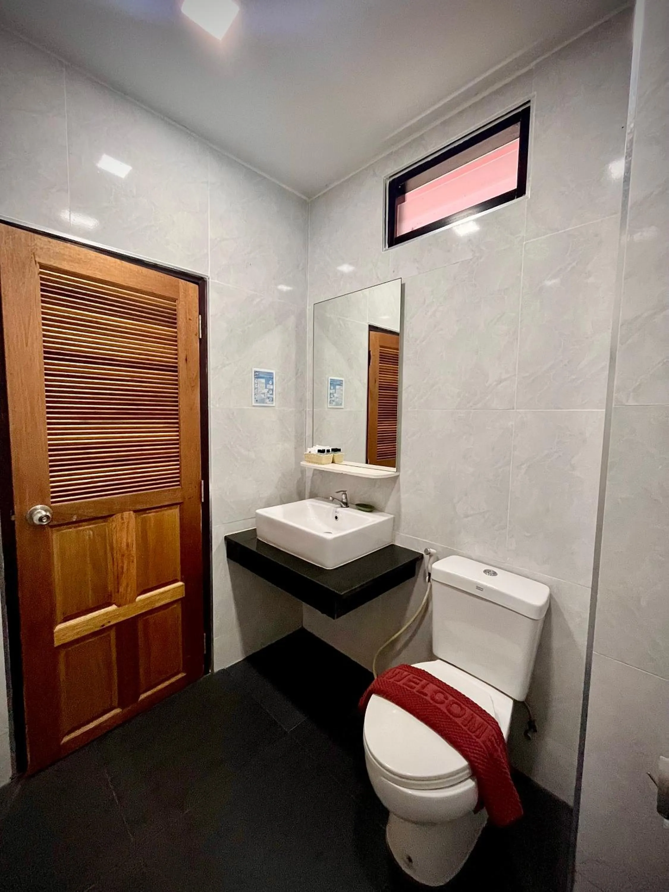 Toilet in Coco Bella Hotel