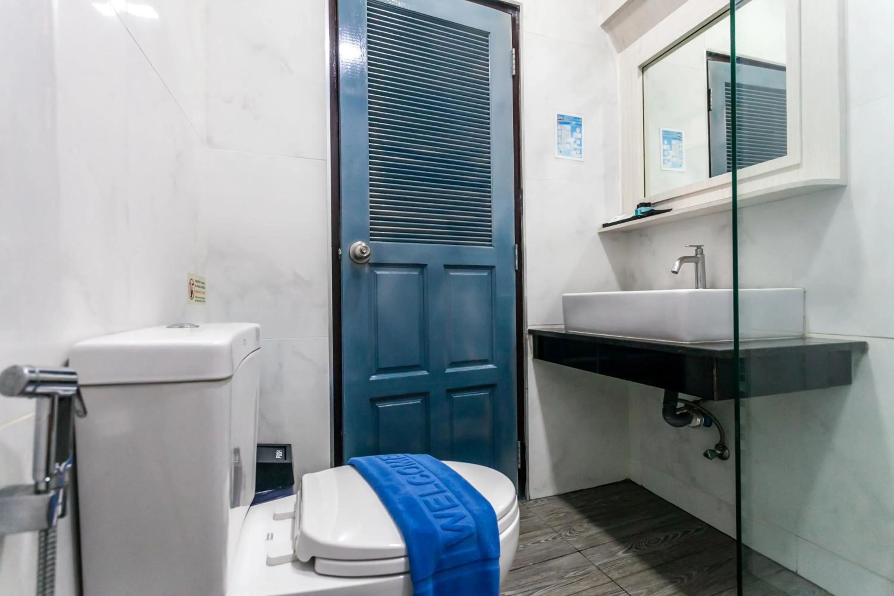 Toilet in Coco Bella Hotel