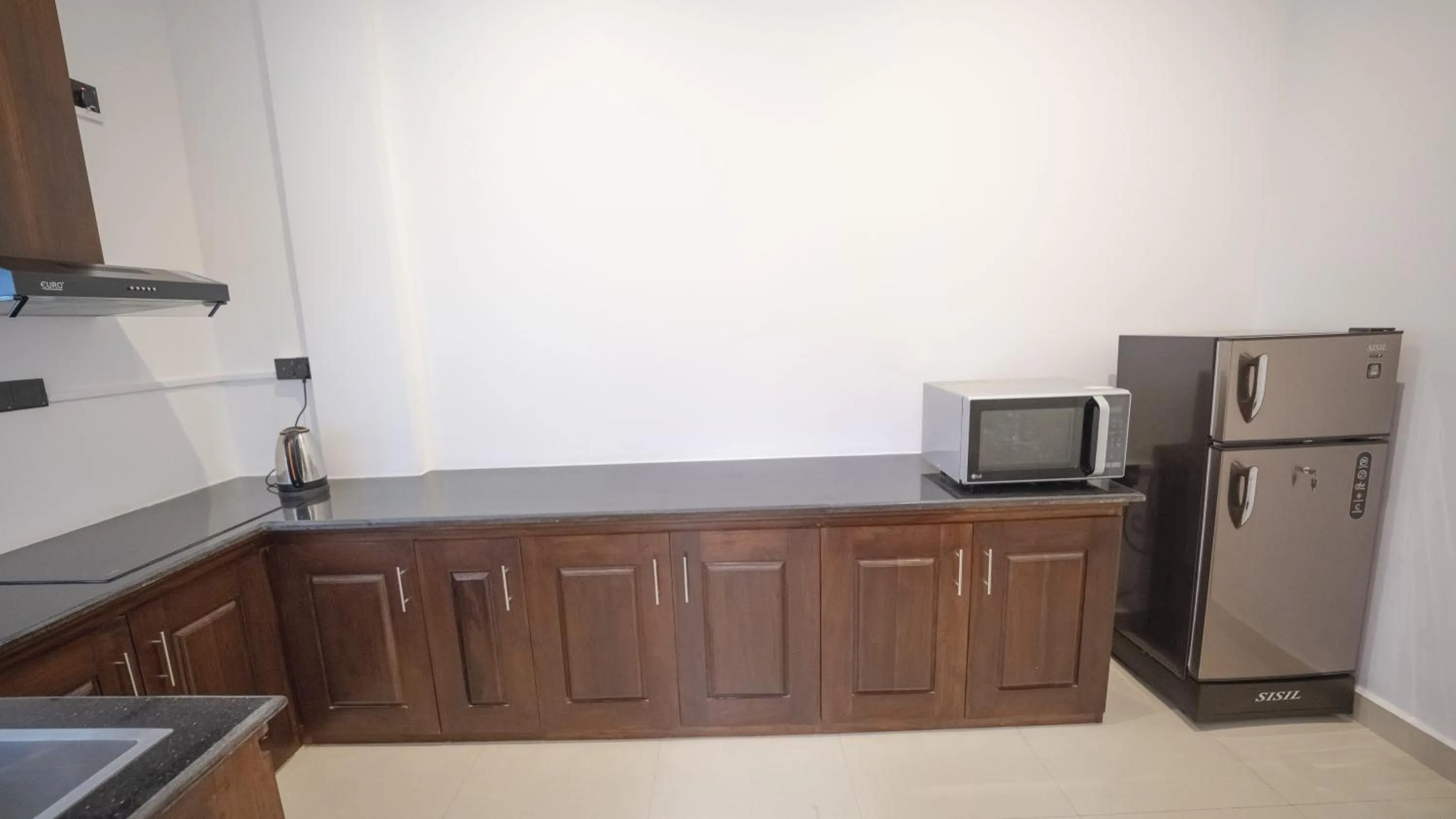 Kitchen or kitchenette in JAMUNA VILLA