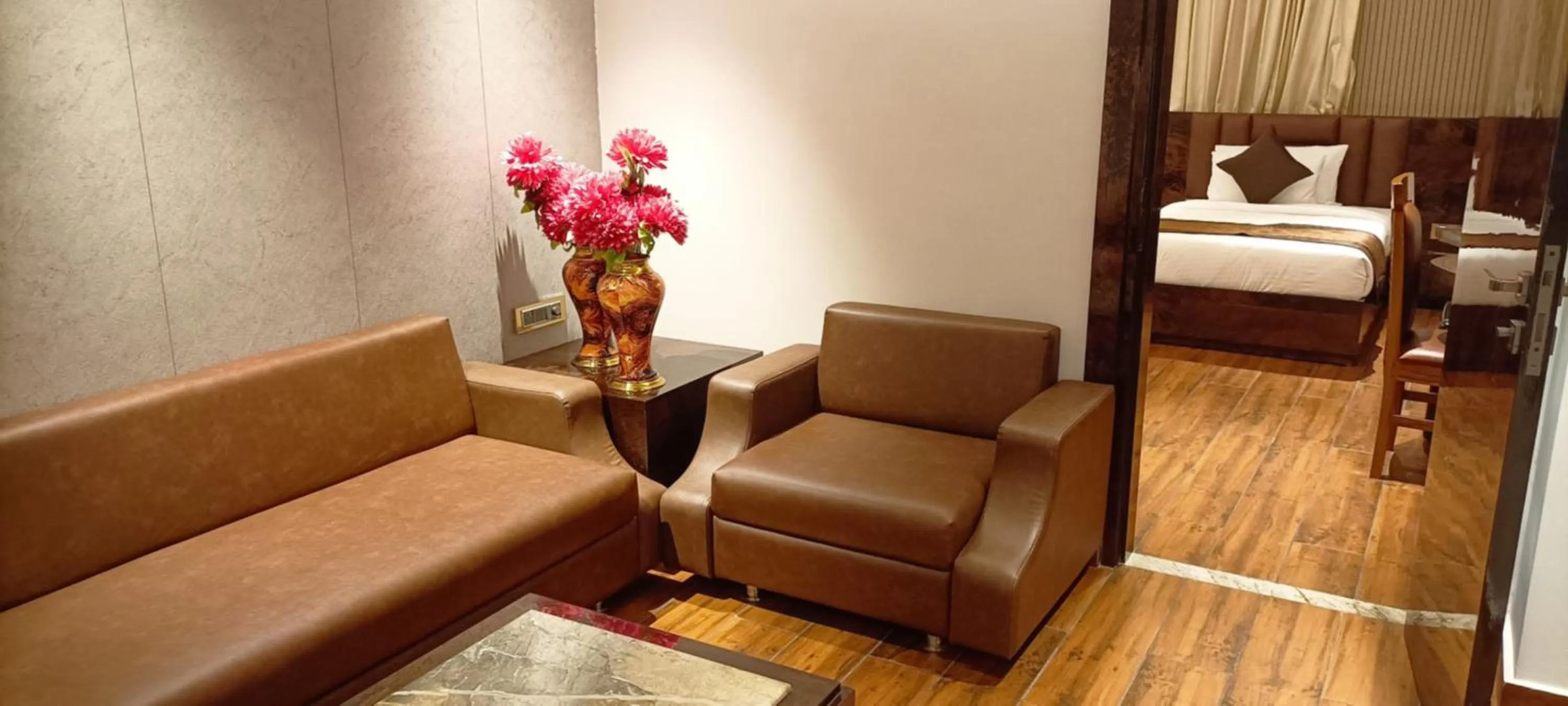 Seating area, Bed in HOTEL SUNCITY PALACE