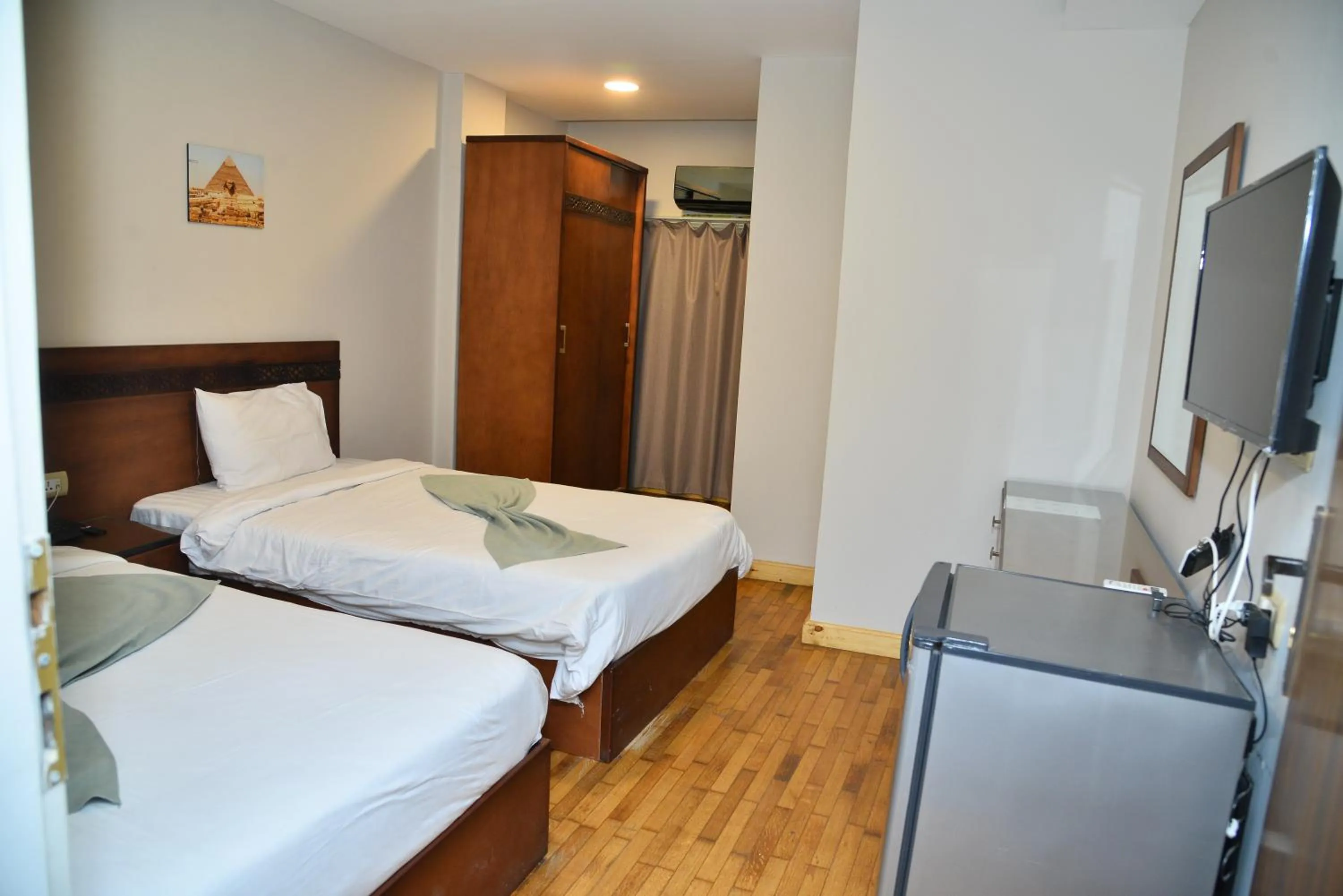 Bed in Miramar Evergreen Hotel