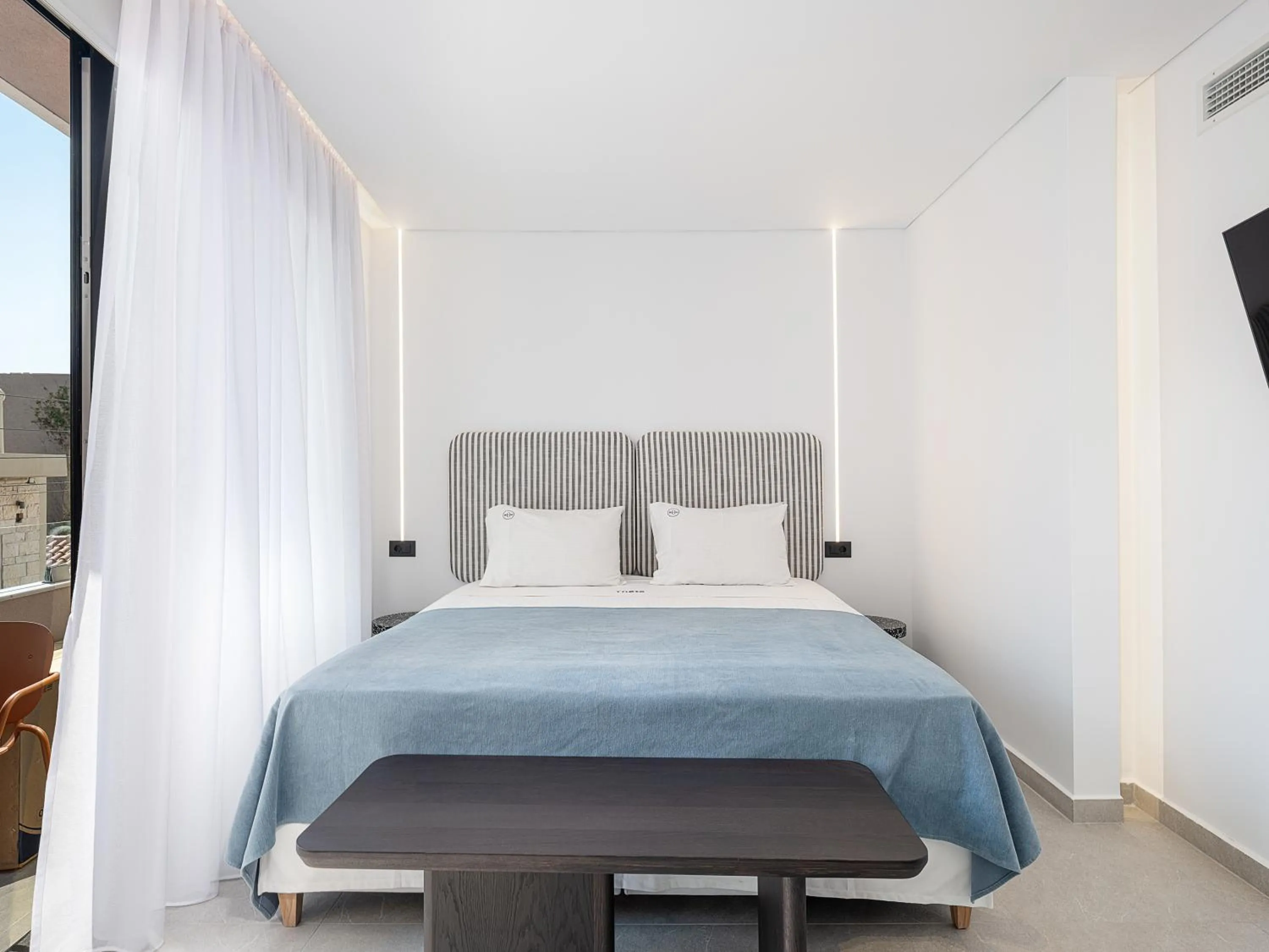 Bed in Theta Boutique Hotel