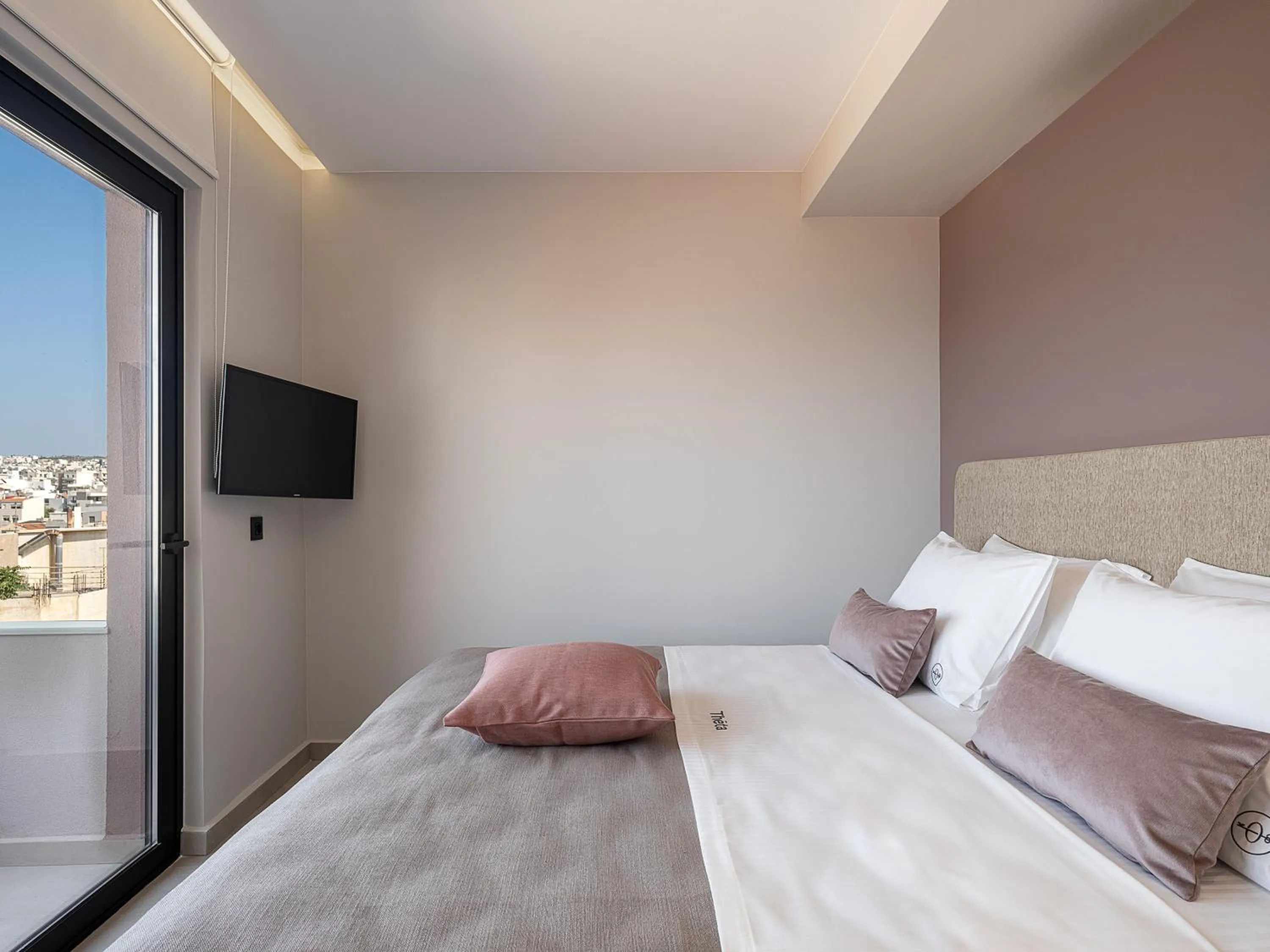 Bed in Theta Boutique Hotel