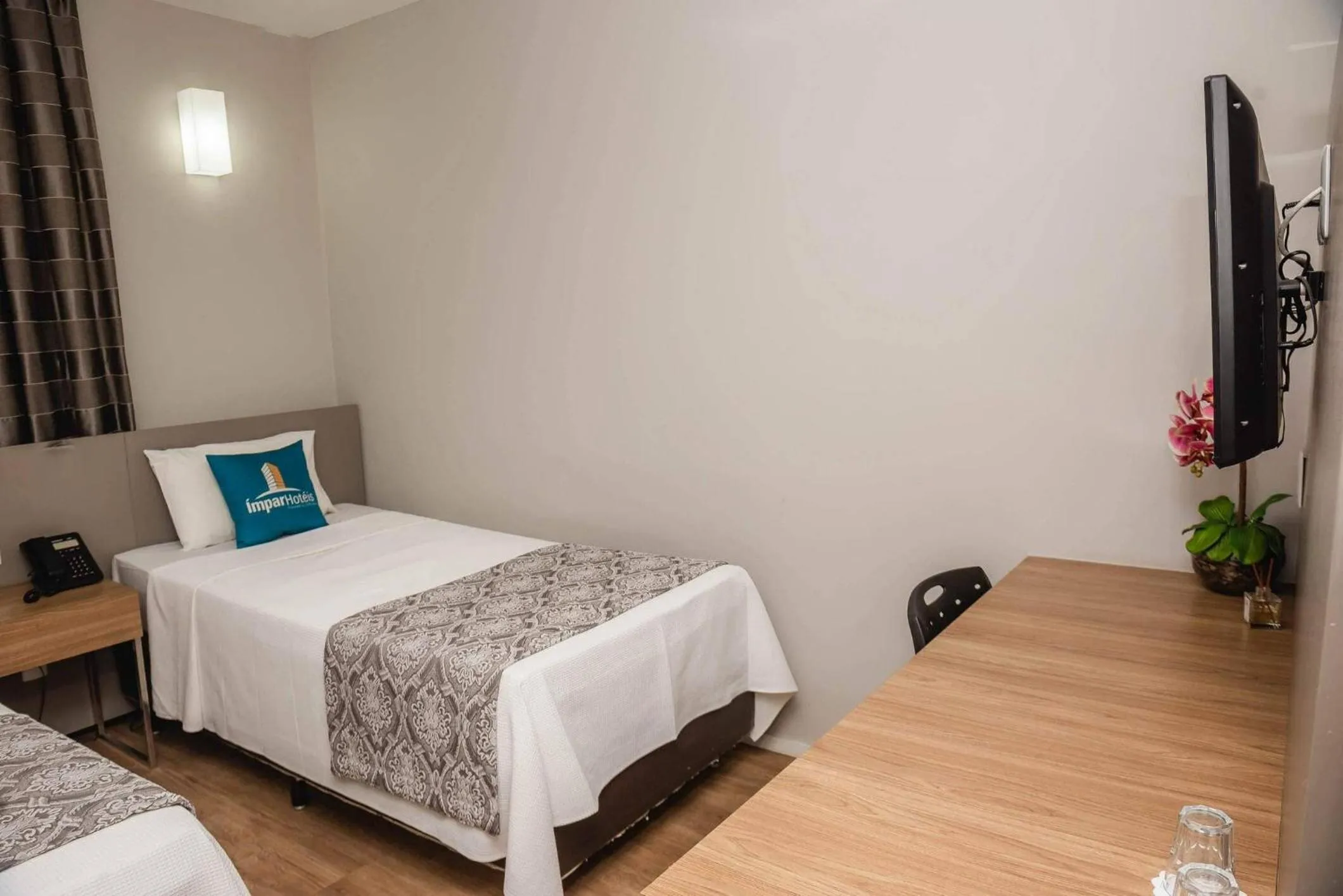 Bed in Ímpar Suítes Expominas