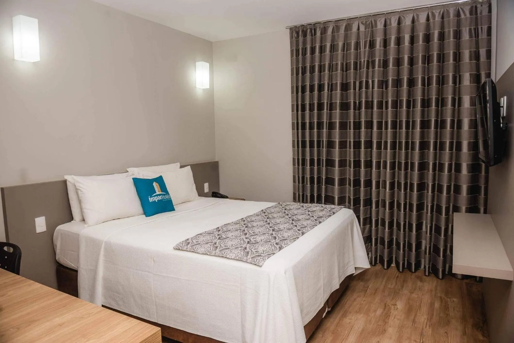 Bed in Ímpar Suítes Expominas