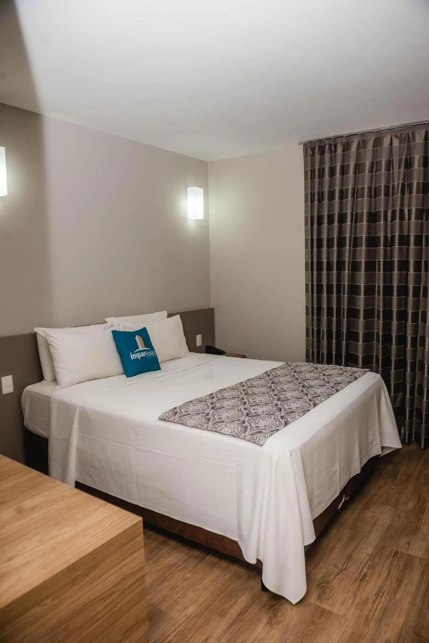 Bed in Ímpar Suítes Expominas