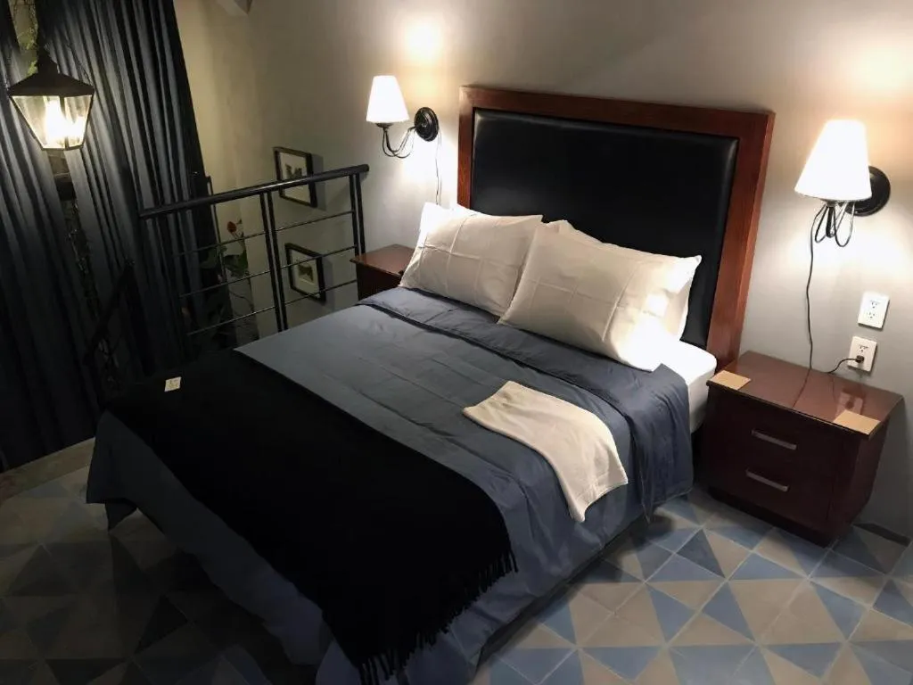 Bed in La Perla Hotel Boutique B&B