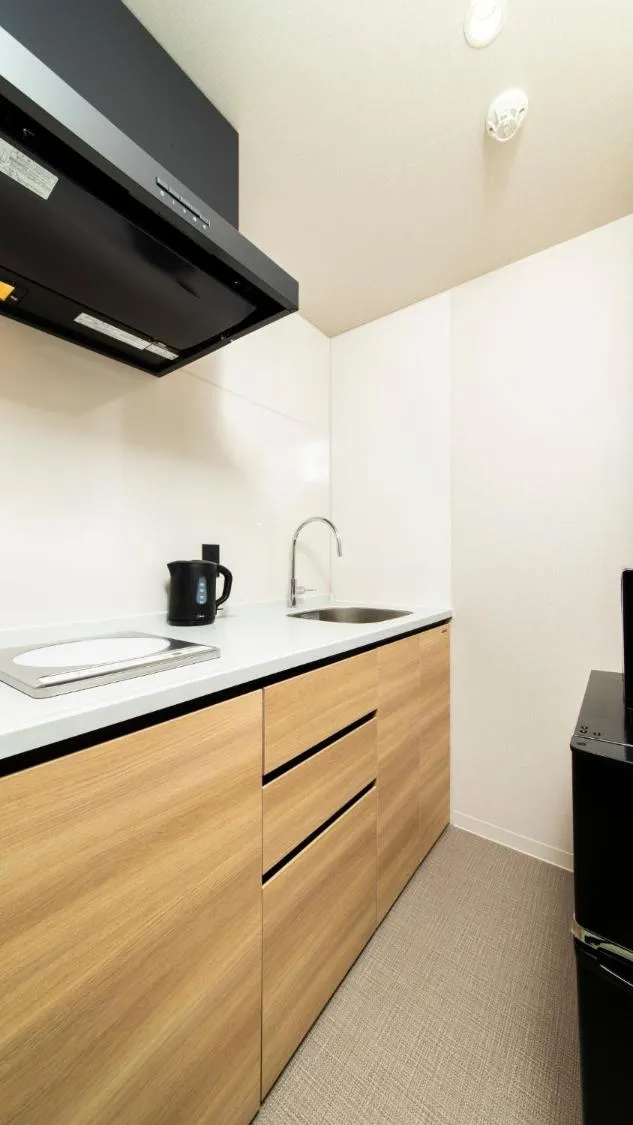 Kitchen or kitchenette in ALPHABED INN Fukuoka Ohori Park