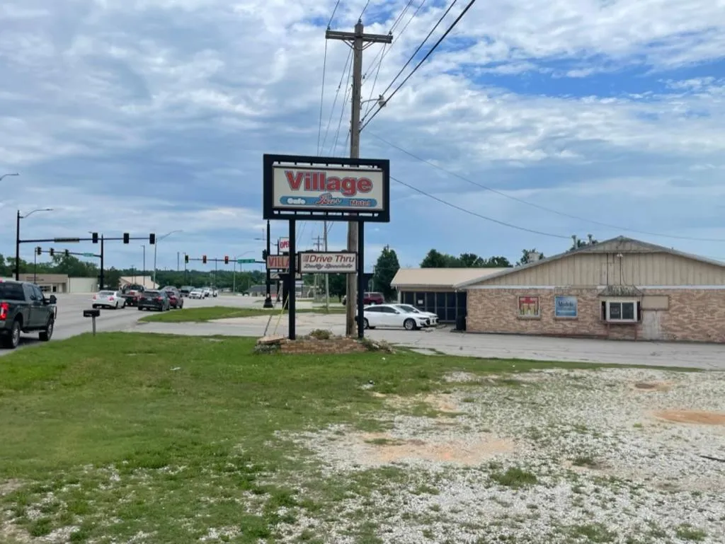 Property logo or sign in Village Inn