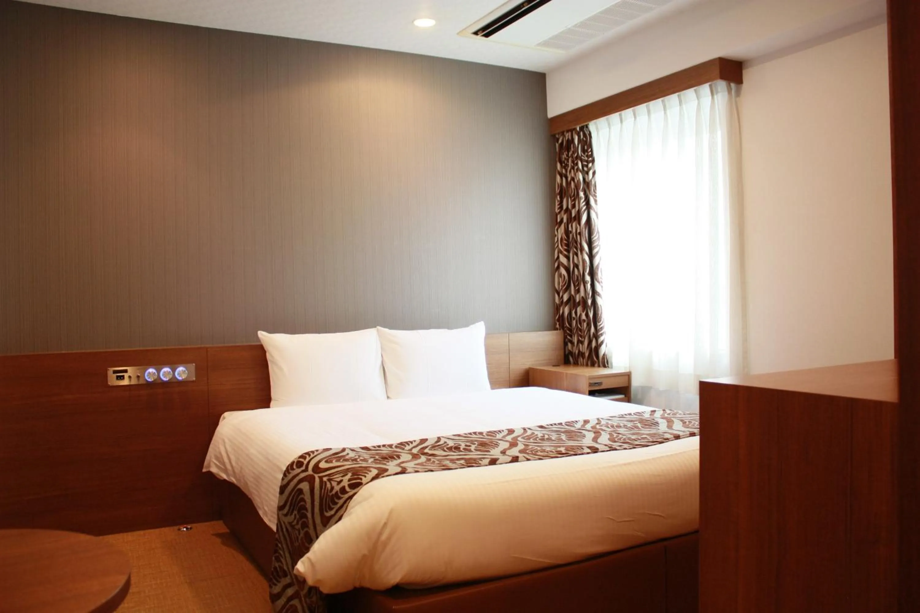 Bed in Hotel LiVEMAX Umeda Central