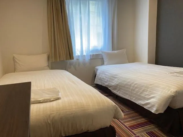 Bed in Hotel LiVEMAX Umeda Central