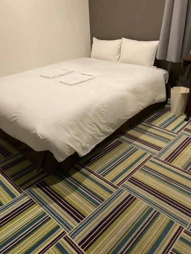 Bed in Hotel LiVEMAX Umeda Central