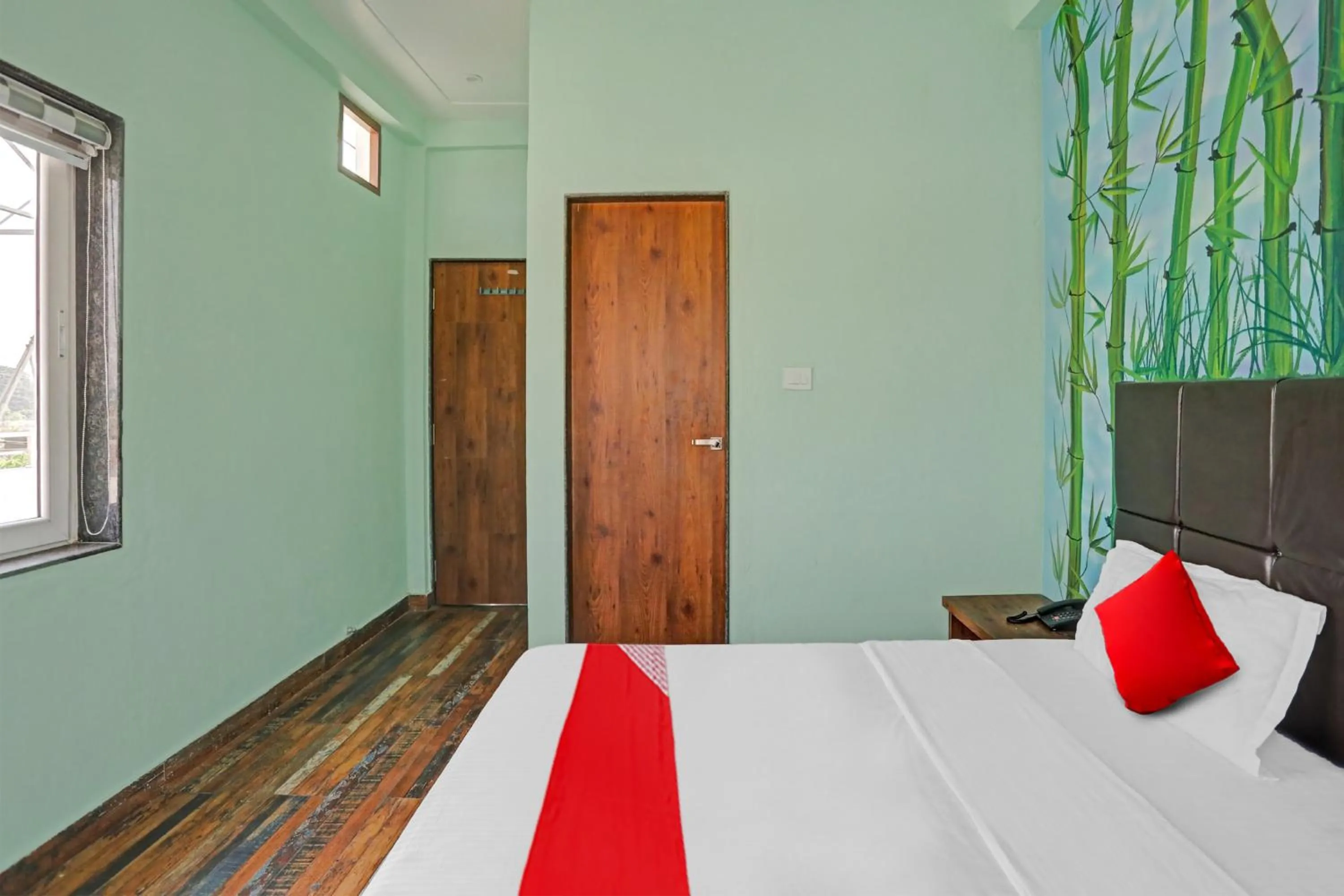 Bedroom in Hotel O MH Inn