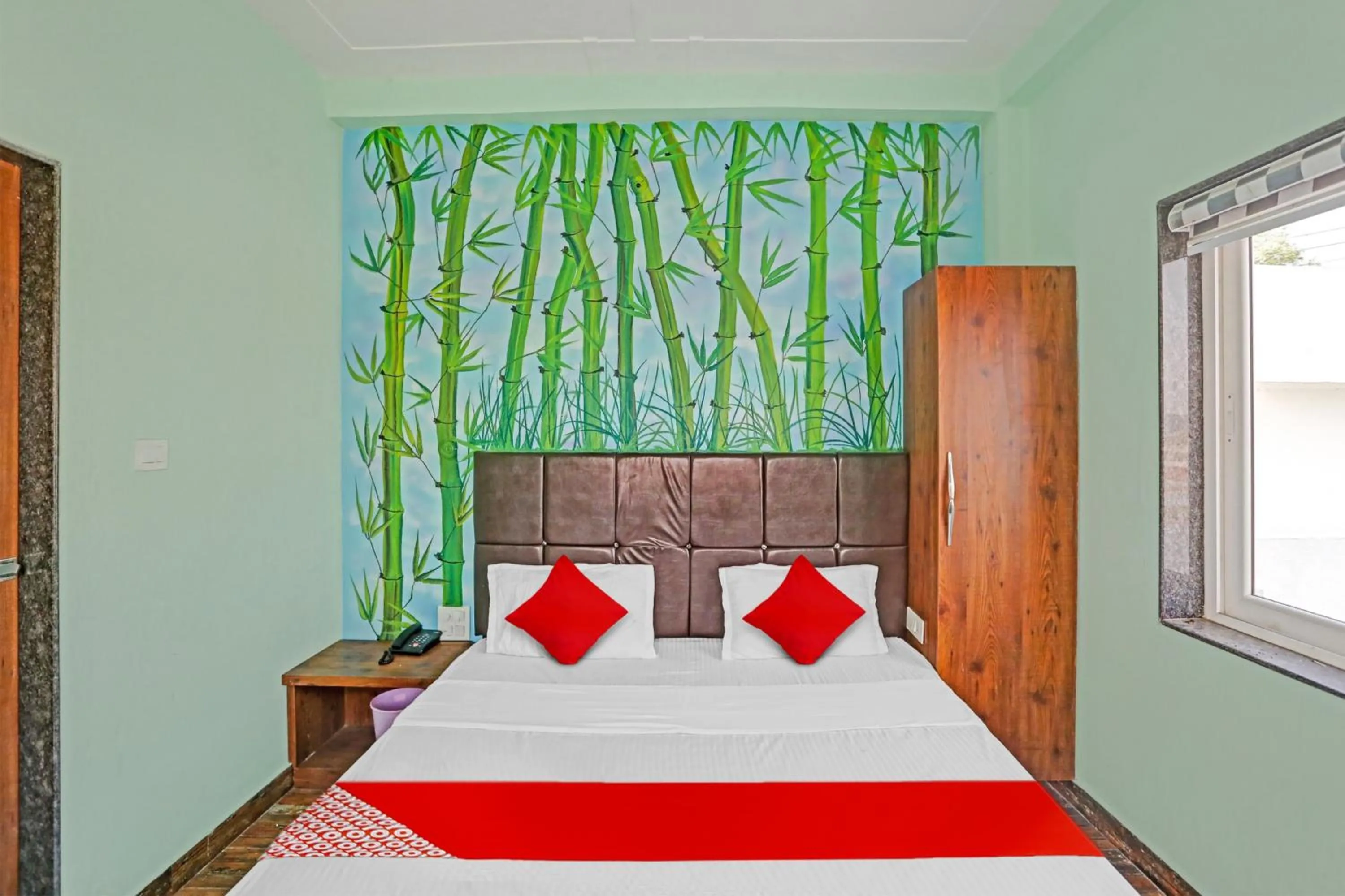 Bedroom in Hotel O MH Inn