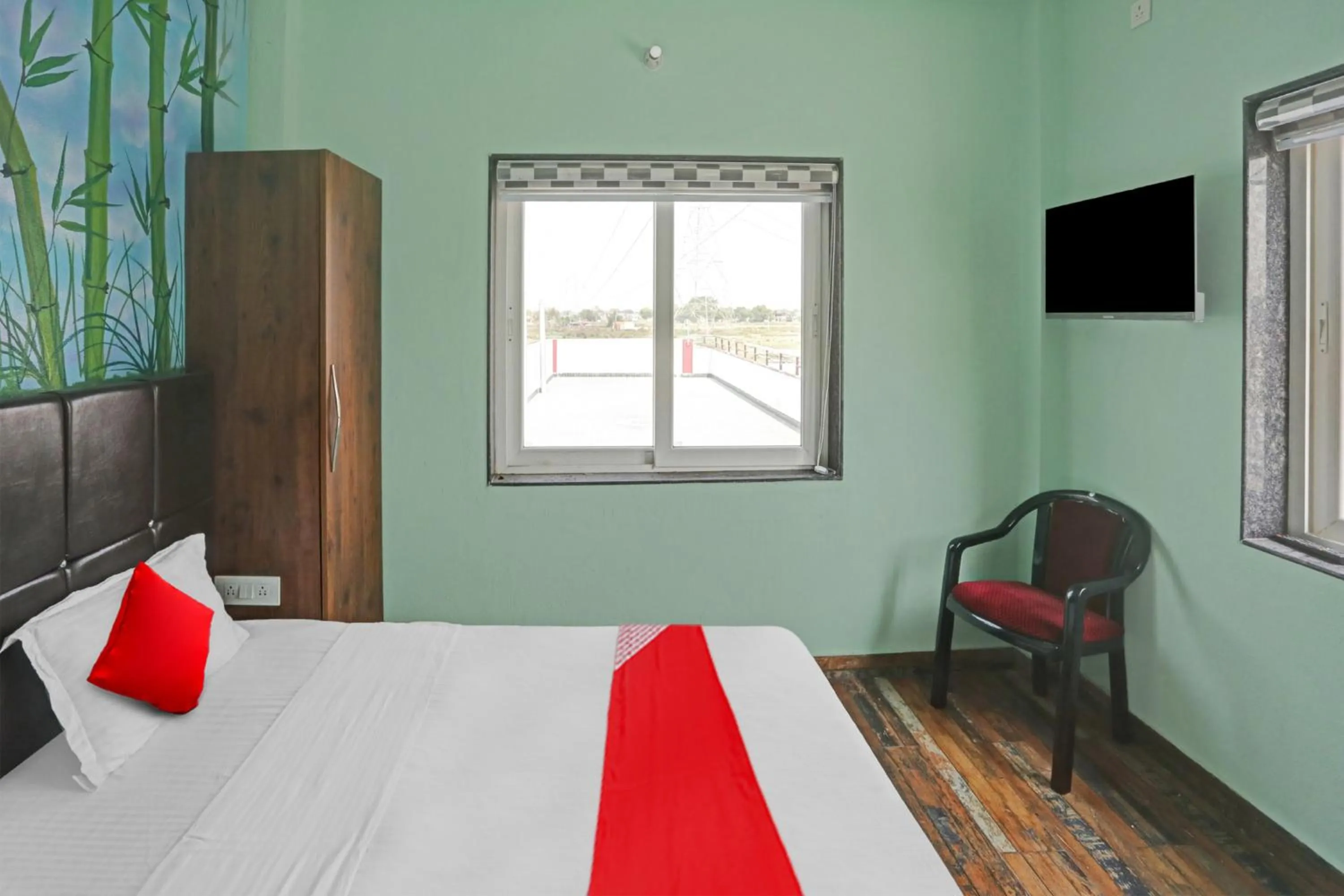 Bedroom in Hotel O MH Inn