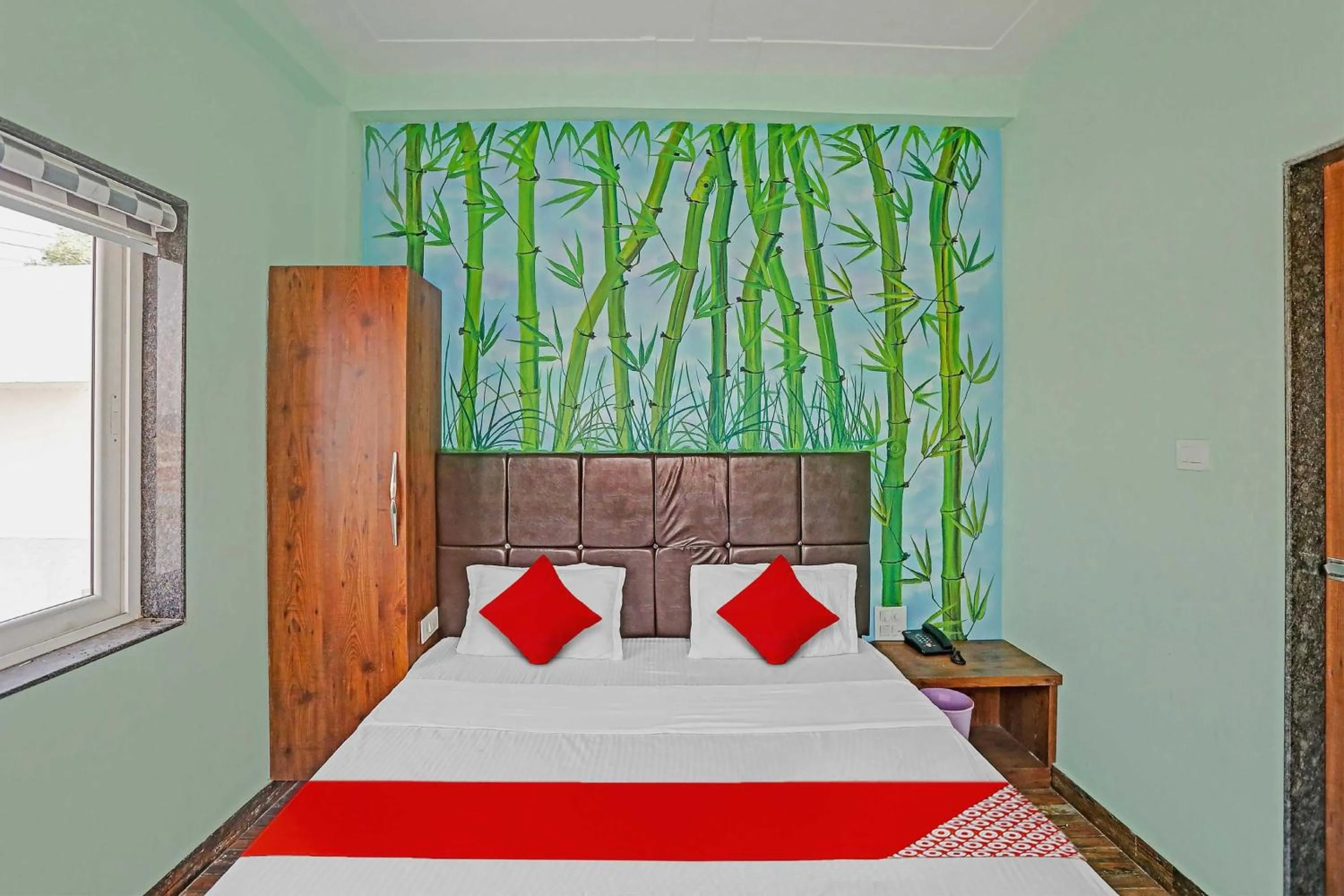 Bedroom in Hotel O MH Inn