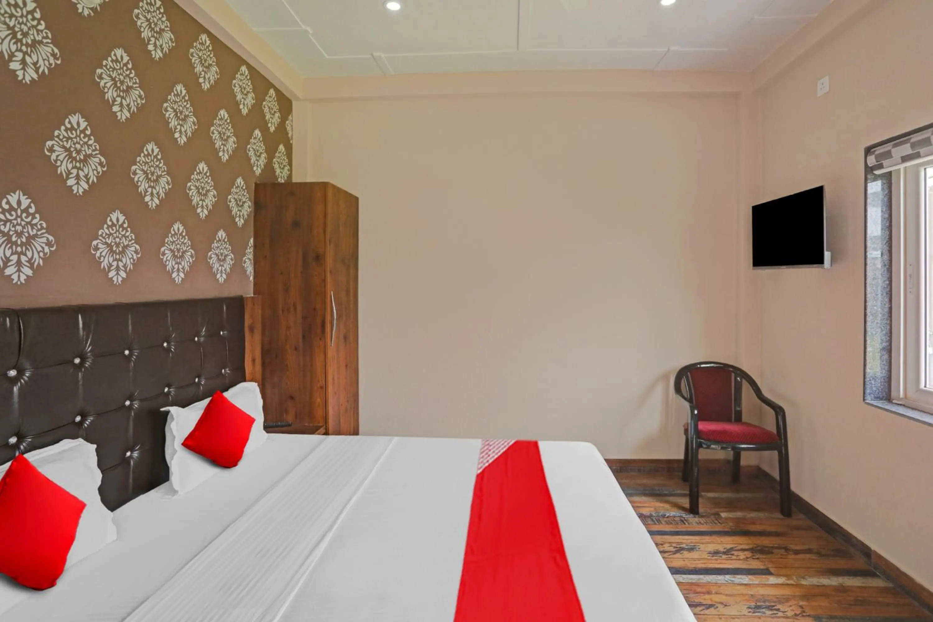 Bedroom in Hotel O MH Inn